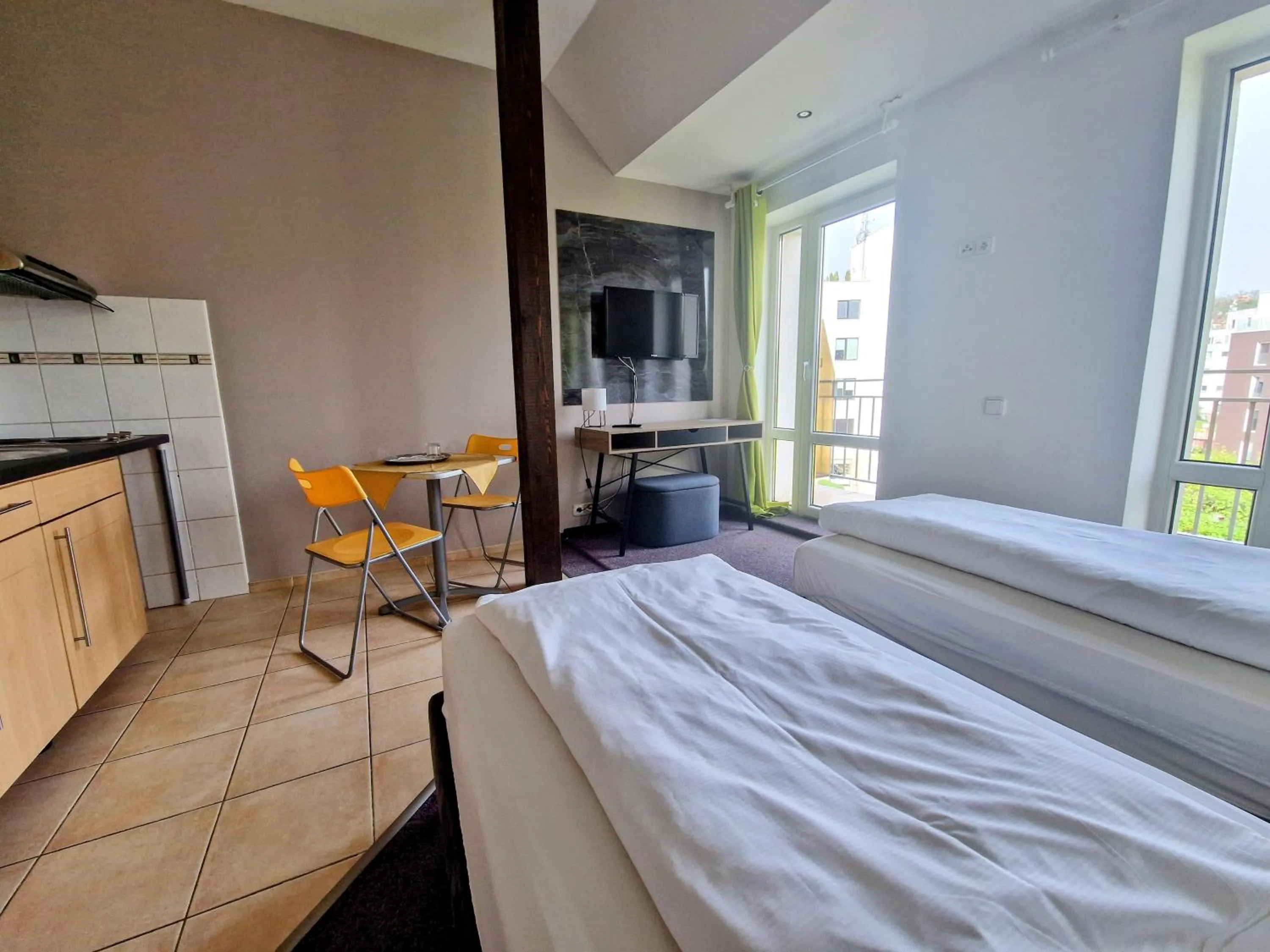 Bed in Family hotel Maxim