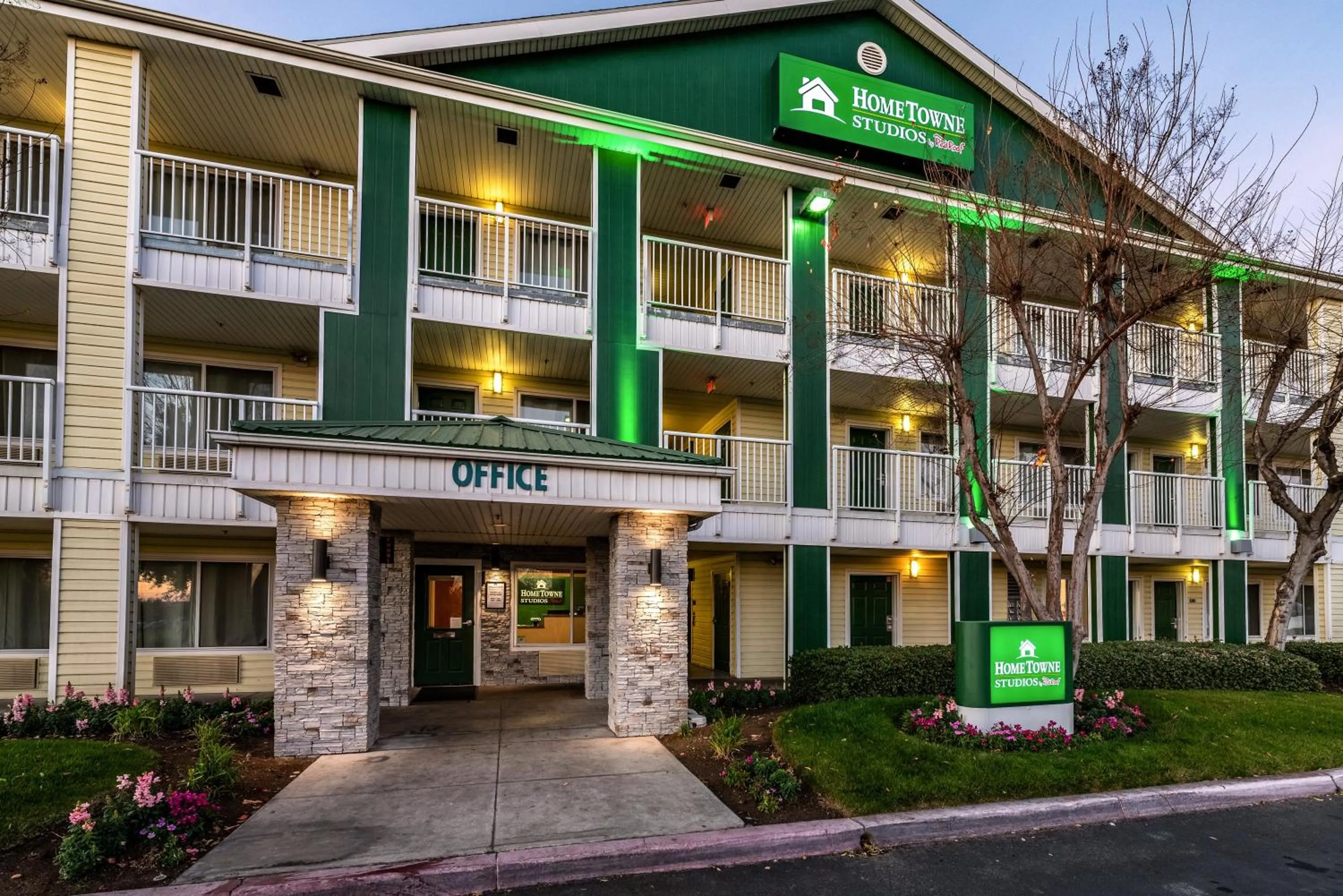 Property building in HomeTowne Studios by Red Roof Fresno - West