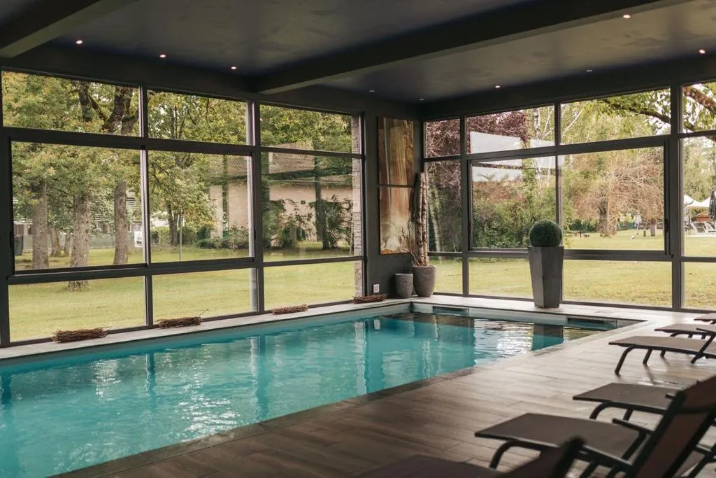 Swimming pool in Le Dracy Hôtel et Spa