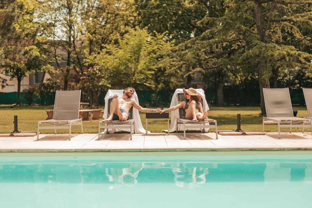 Swimming pool in Le Dracy Hôtel et Spa