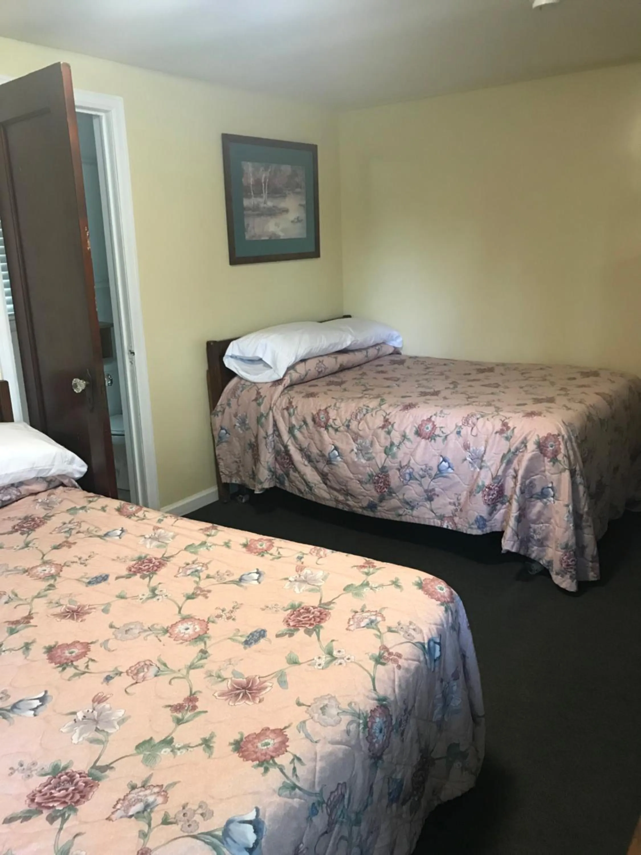 Bed in Evergreen Motel