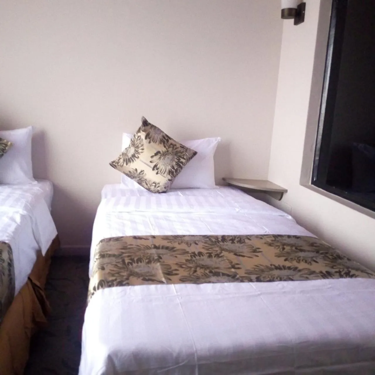 Bed in Maple Inn Hotel