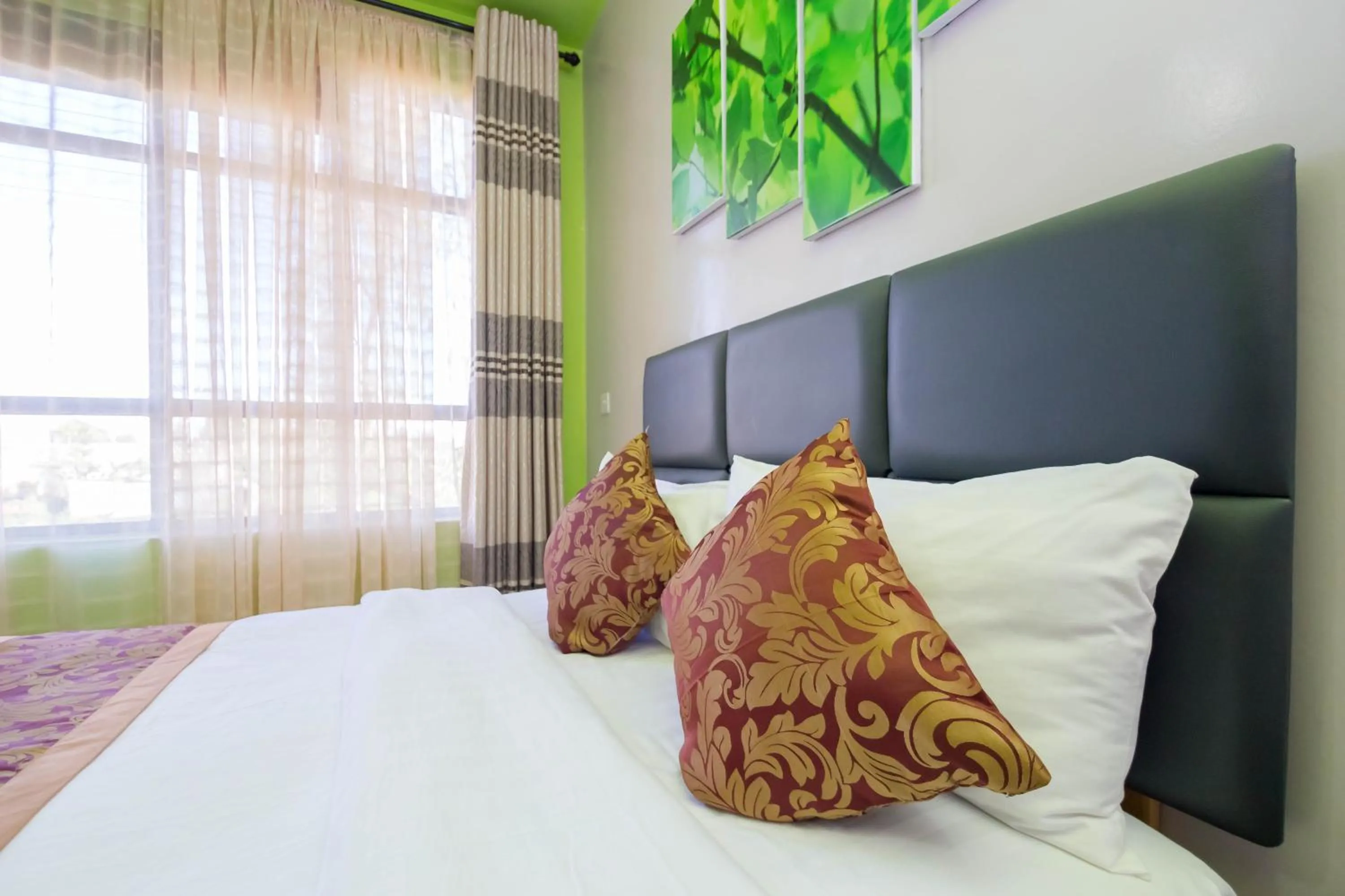 Bed in Maple Inn Hotel