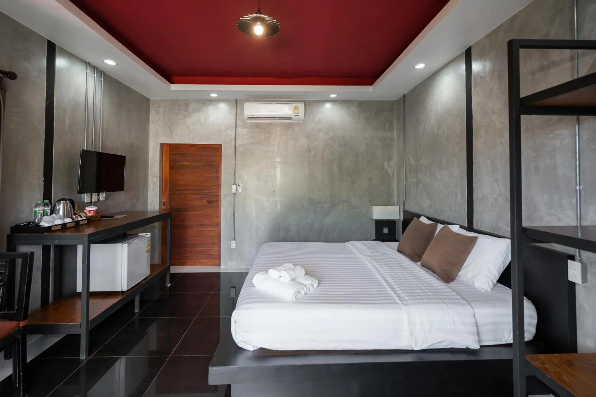 Bed in The Loft Panwa Resort