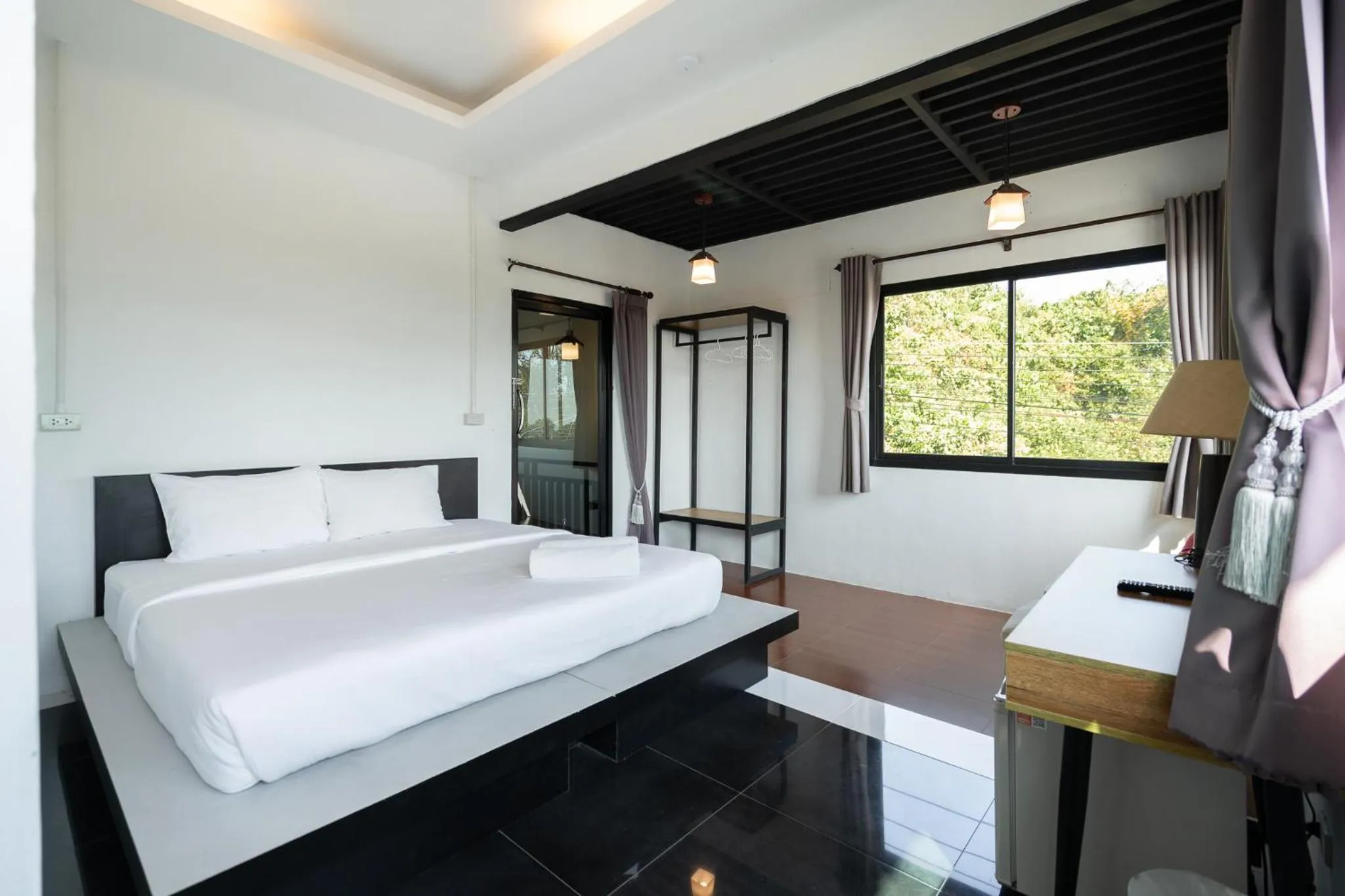 Bed in The Loft Panwa Resort