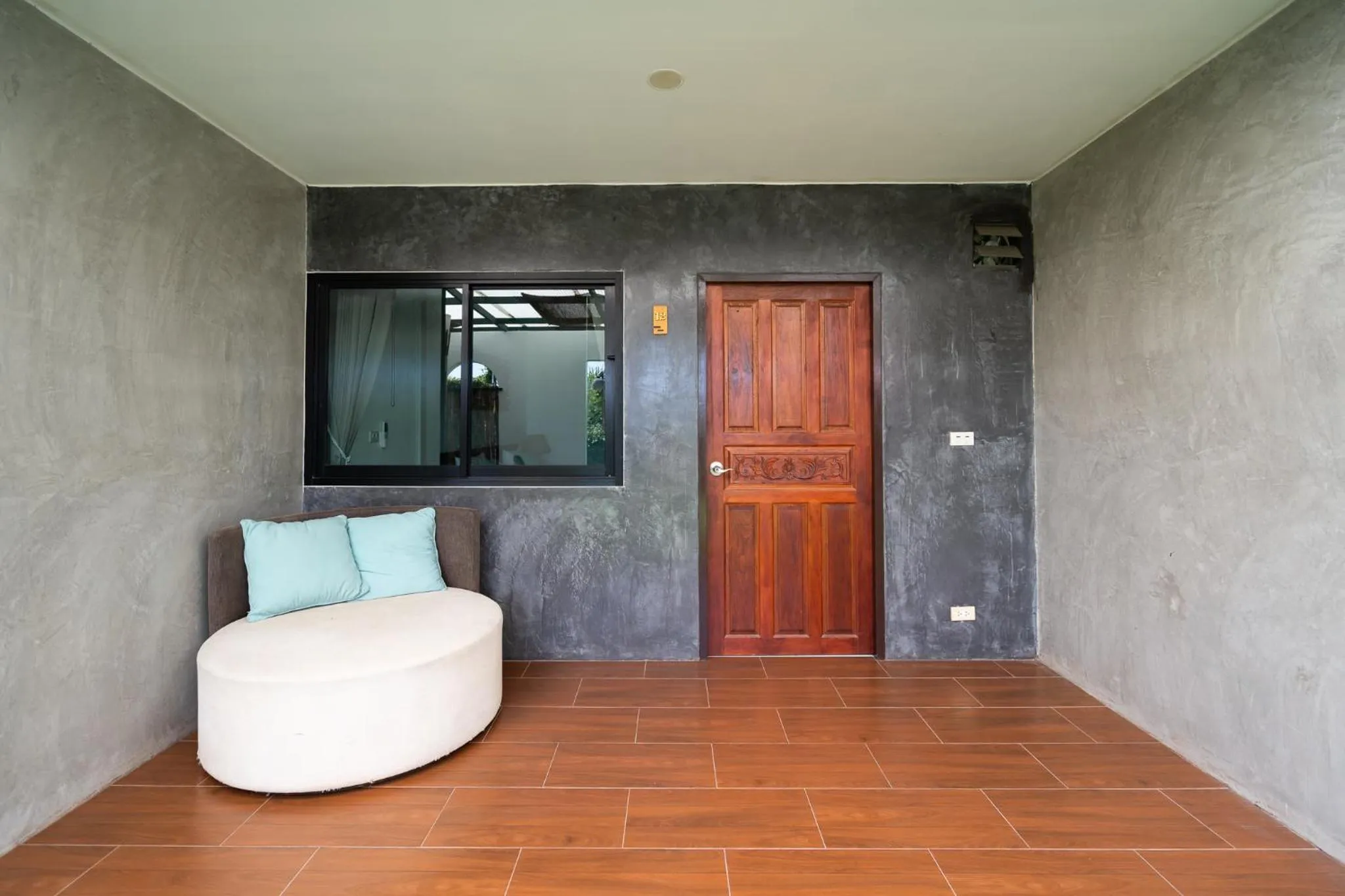 Seating area in The Loft Panwa Resort