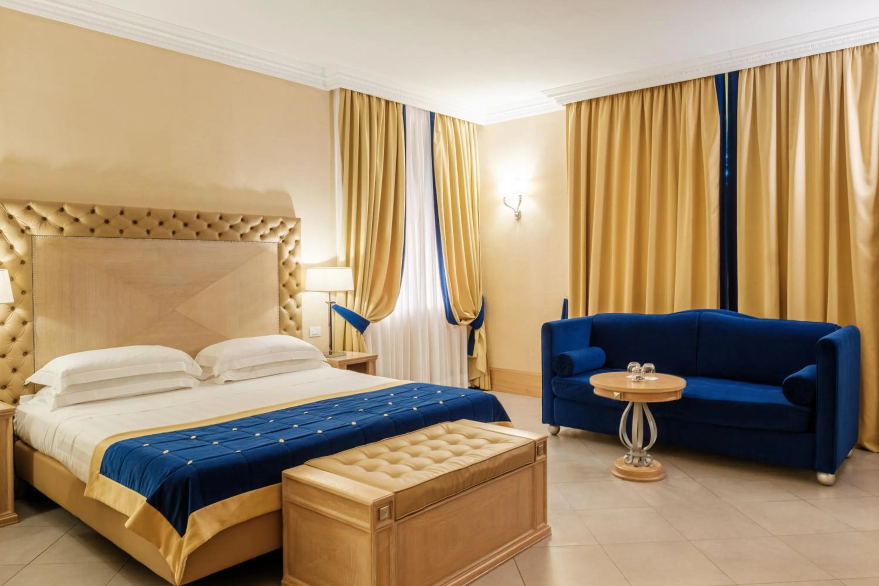 Bed in Villa Tolomei Hotel & Resort