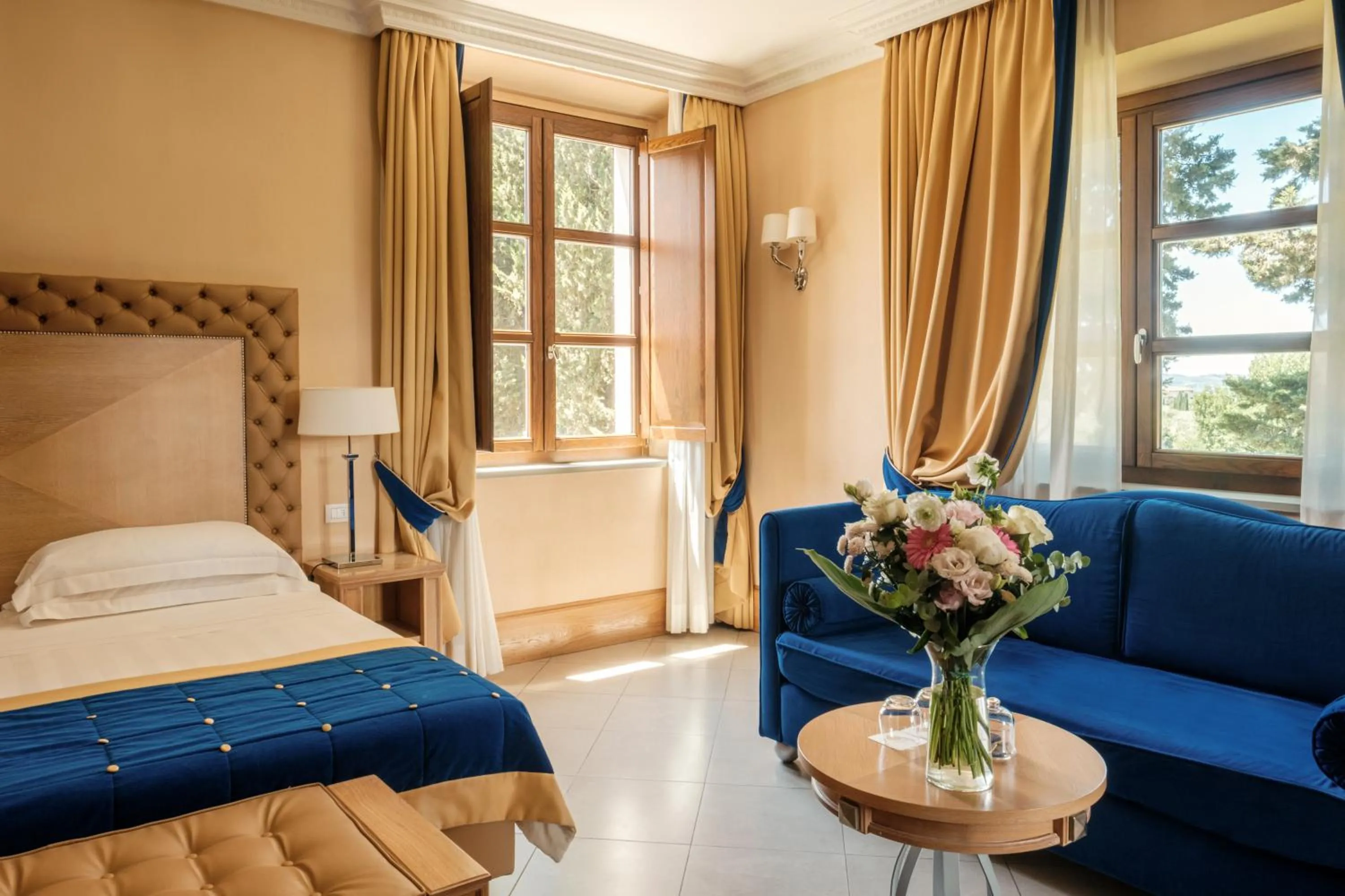 Bed in Villa Tolomei Hotel & Resort
