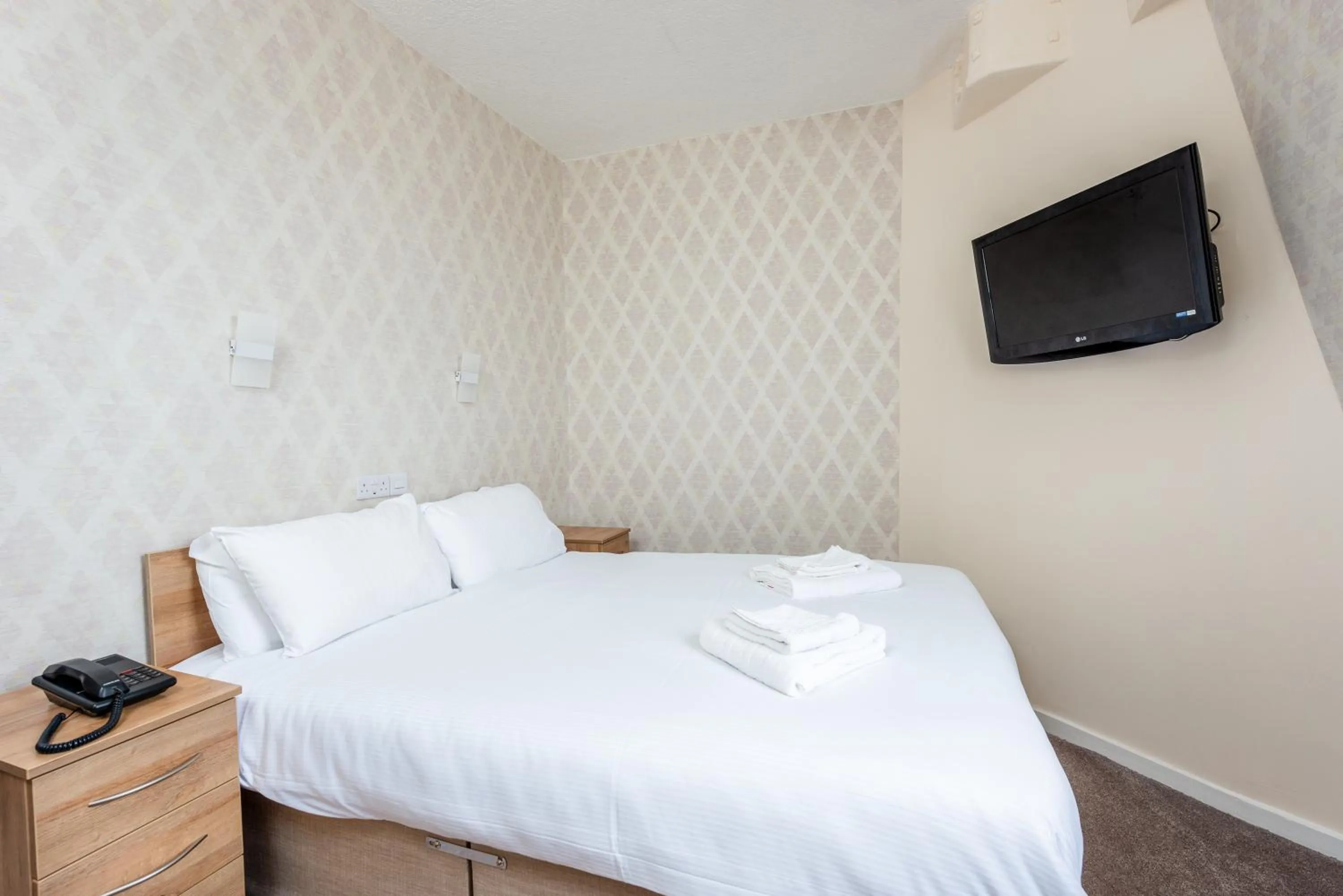 Bed in The Esplanade Hotel