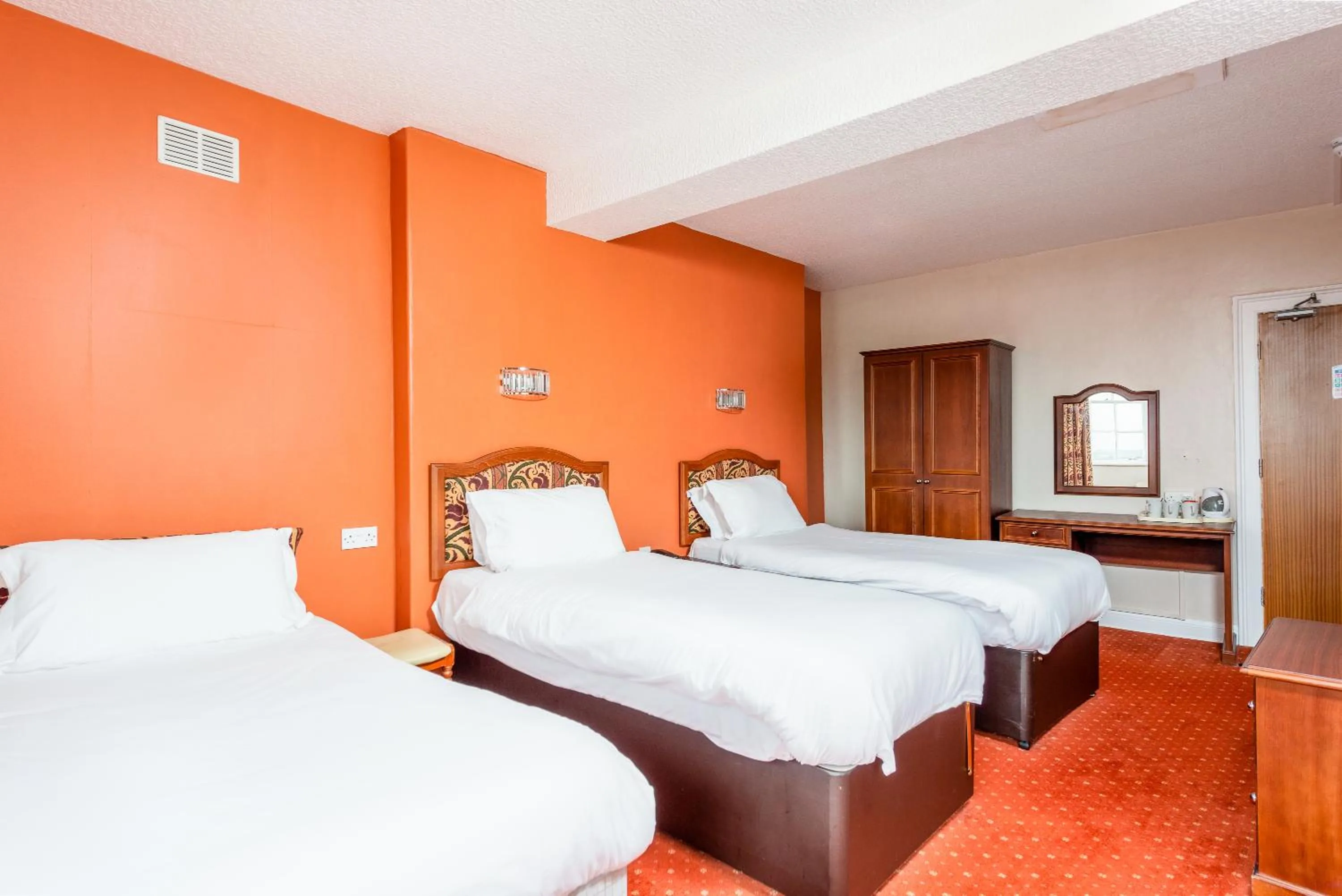 Bed in The Esplanade Hotel