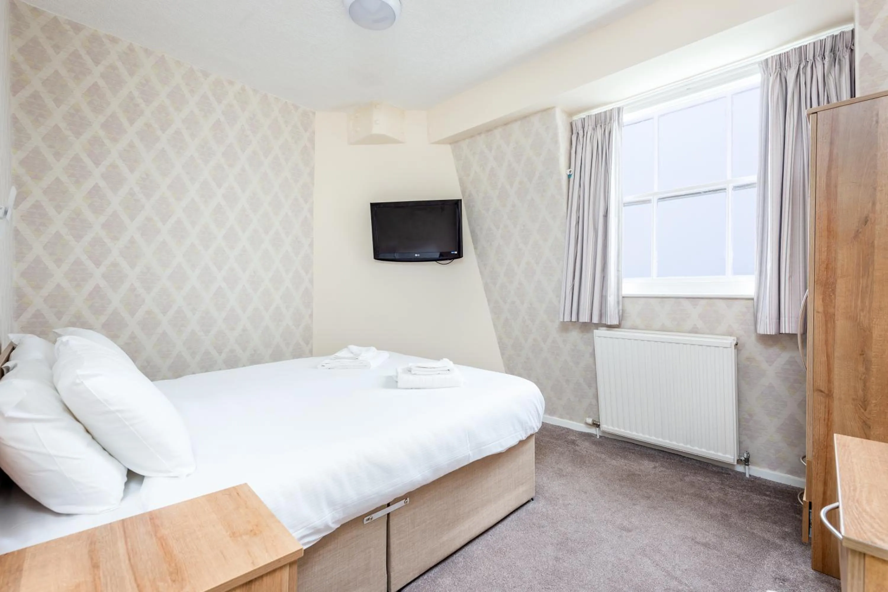 Bed in The Esplanade Hotel