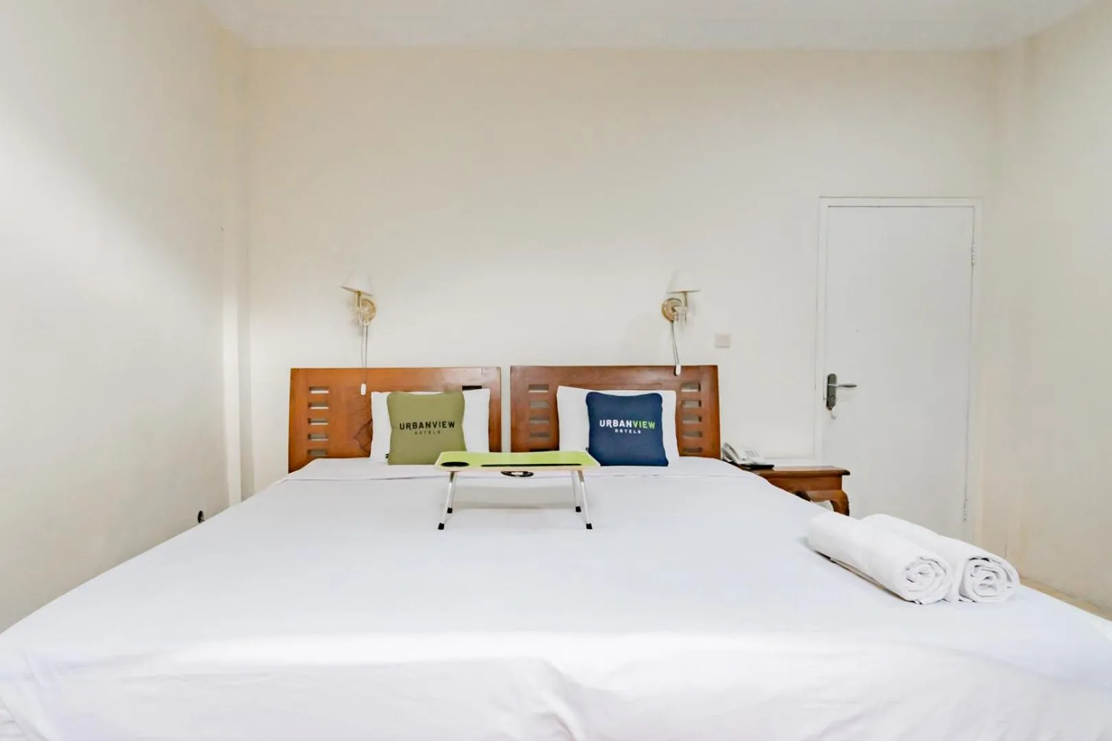 Photo of the whole room, Bed in Urbanview Hotel Mon Bel Cibodas by RedDoorz