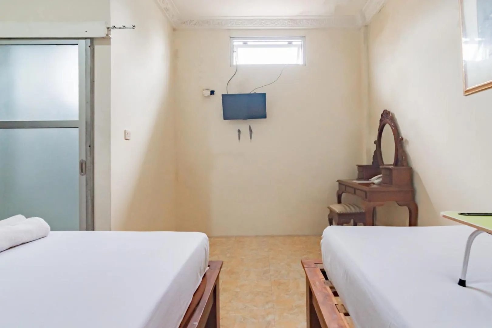 Photo of the whole room, Bed in Urbanview Hotel Mon Bel Cibodas by RedDoorz