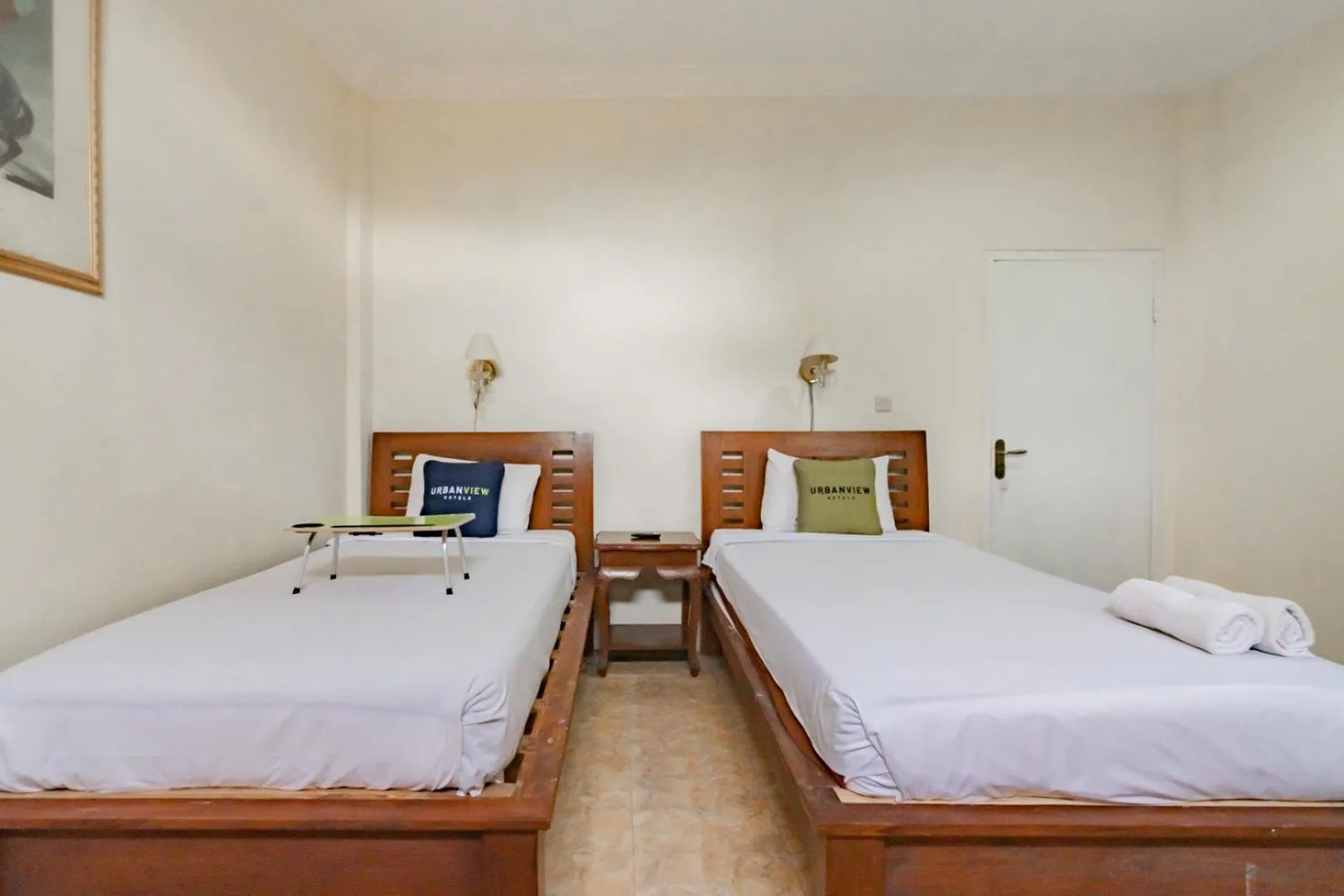 Photo of the whole room, Bed in Urbanview Hotel Mon Bel Cibodas by RedDoorz