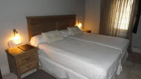 Bed in Hotel Palacio de Mengibar