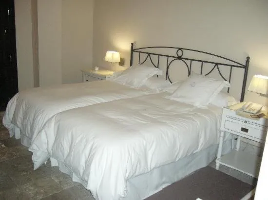 Bed in Hotel Palacio de Mengibar