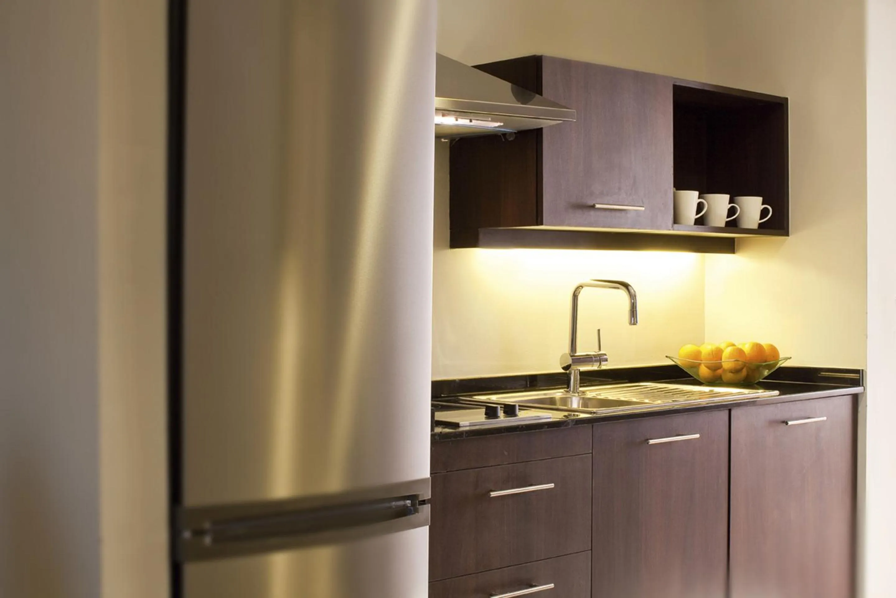 Kitchen or kitchenette in Mövenpick Hotel Apartments Al Mamzar Dubai