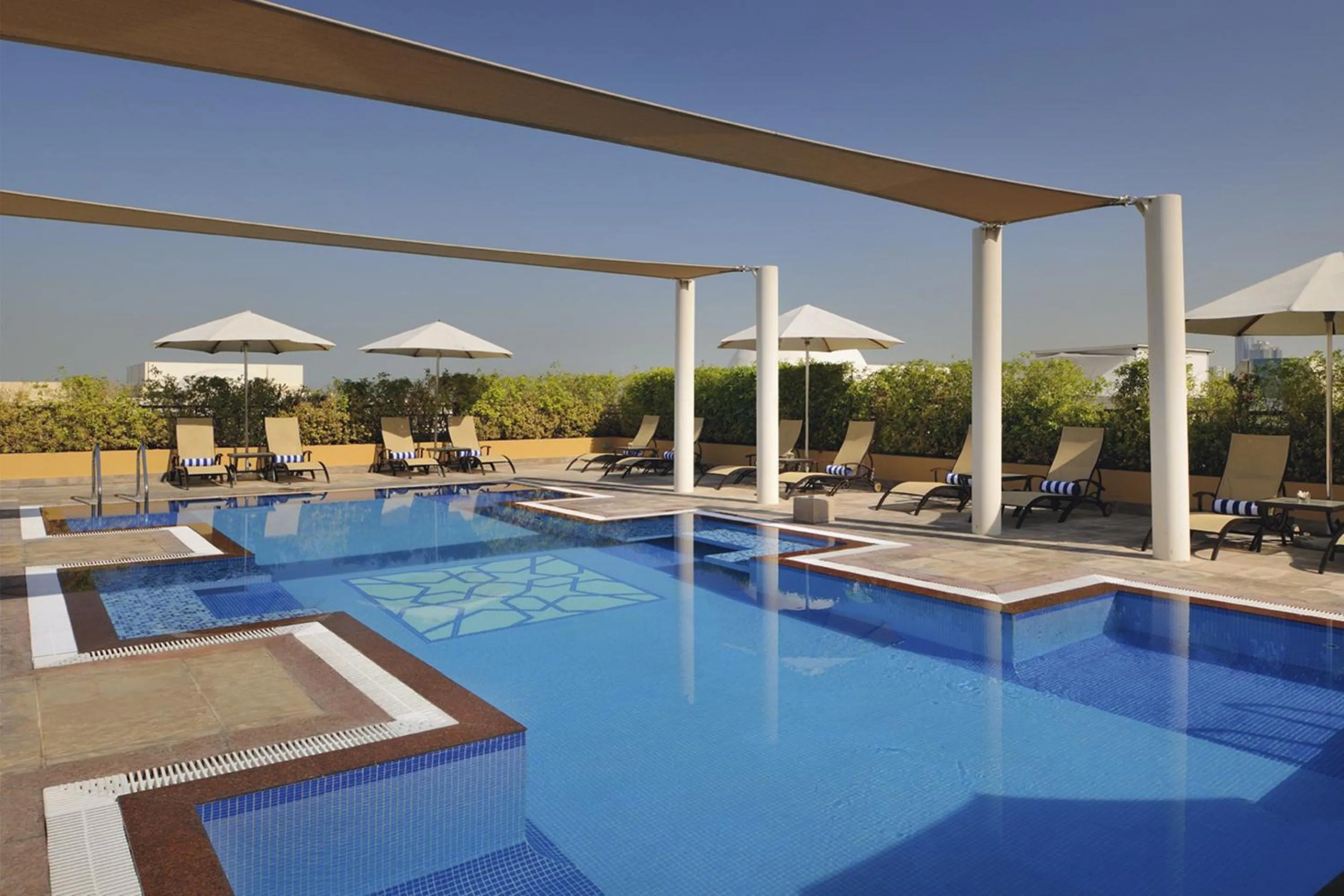 Swimming pool in Mövenpick Hotel Apartments Al Mamzar Dubai