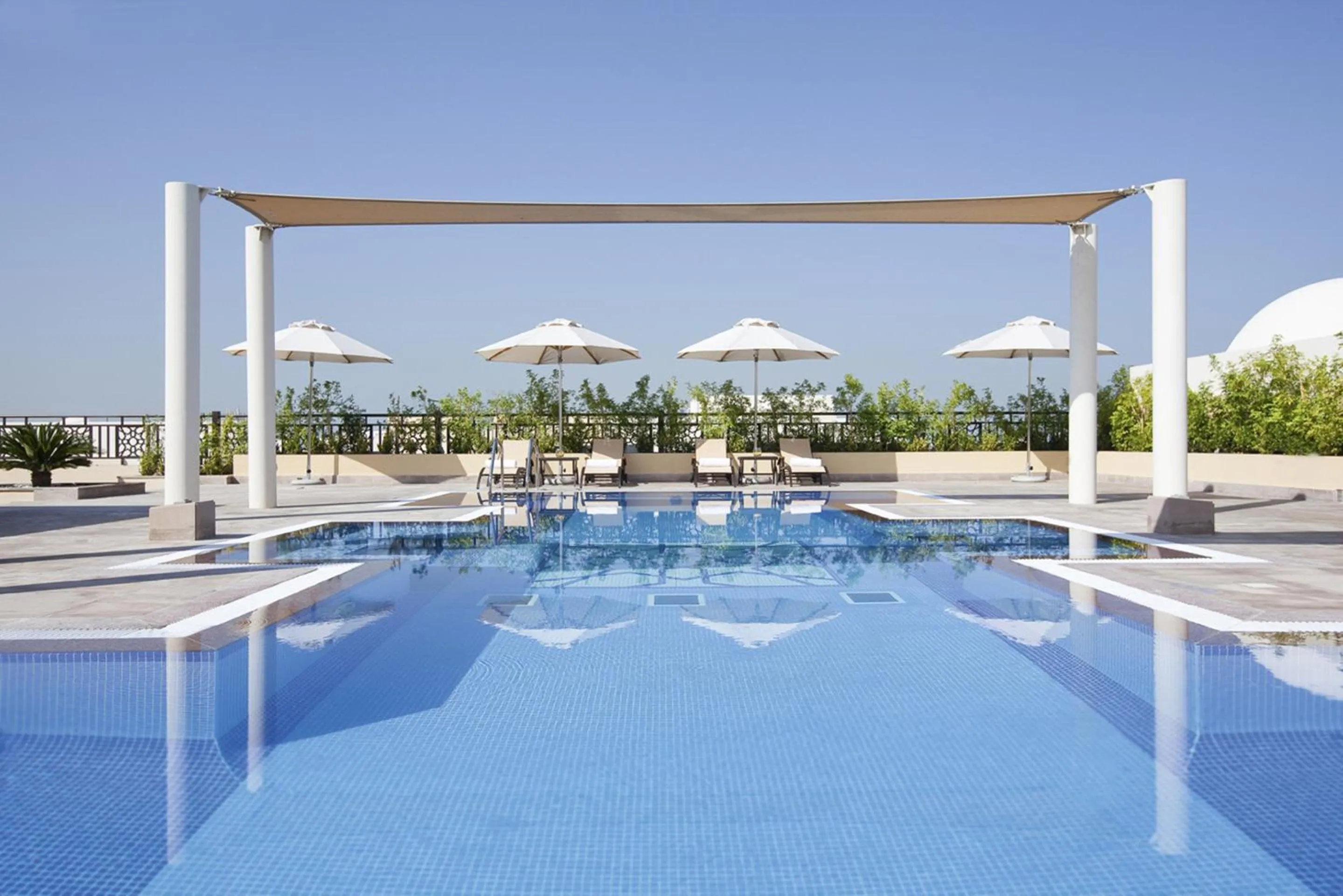 Swimming pool in Mövenpick Hotel Apartments Al Mamzar Dubai