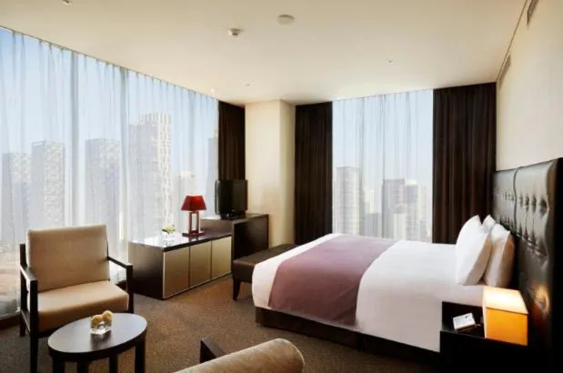 Bed in Orakai Songdo Park Hotel