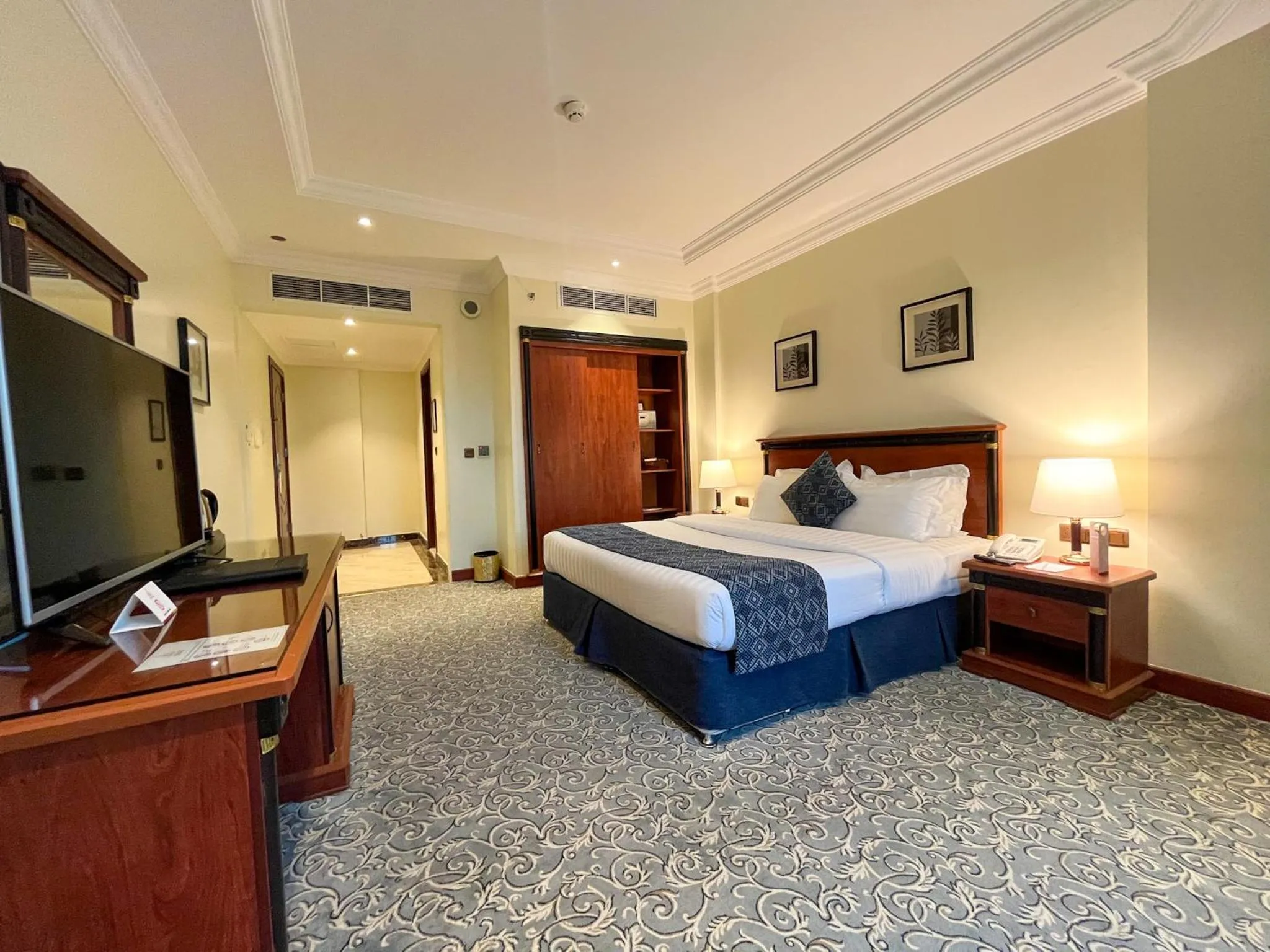 Bed in Crown Tower Hotel