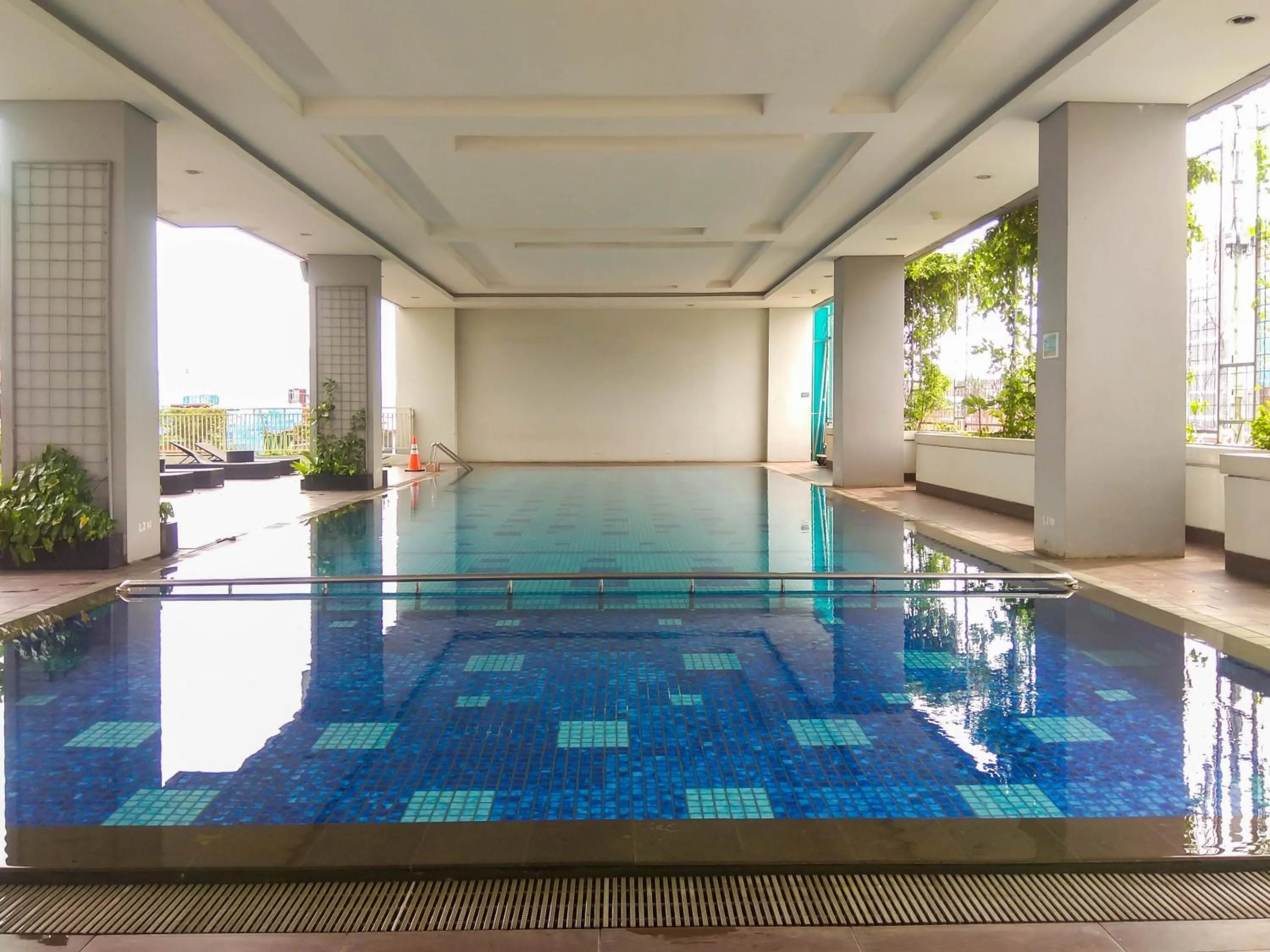 Property building in Modern and Brand New Studio Apartment H Residence By Travelio