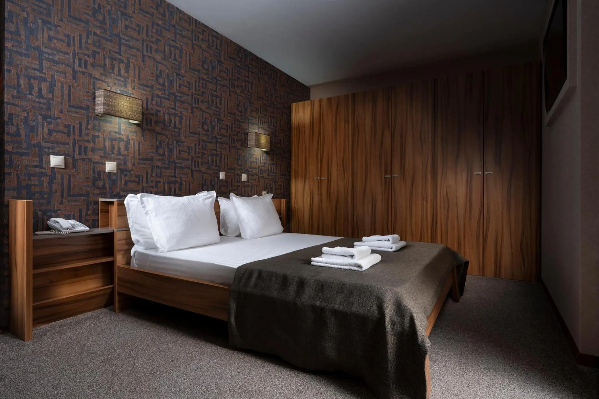 Bed in Boutique Hotel Uniqato