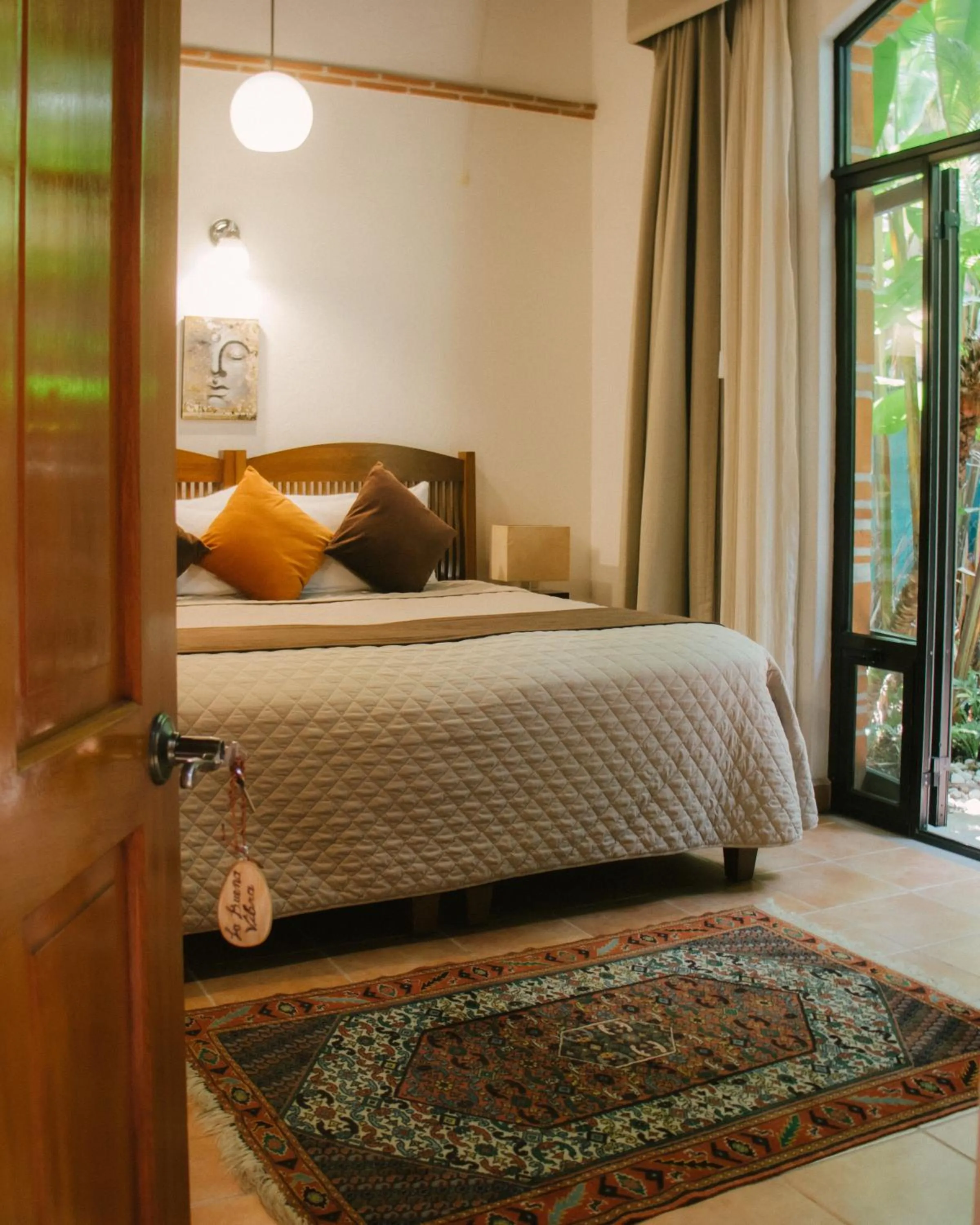 Bed in La Buena Vibra Wellness Resort & Spa