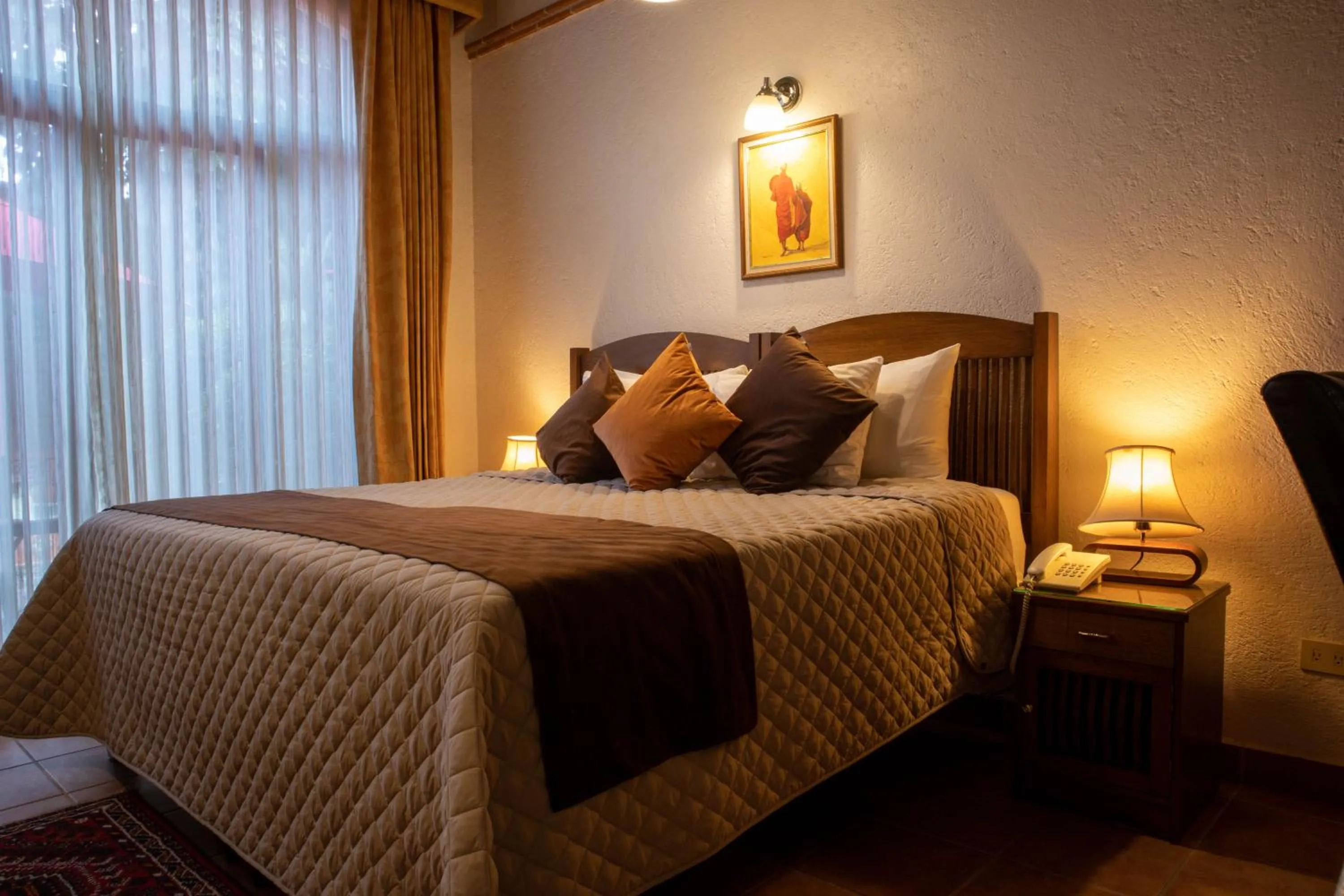 Bed in La Buena Vibra Wellness Resort & Spa