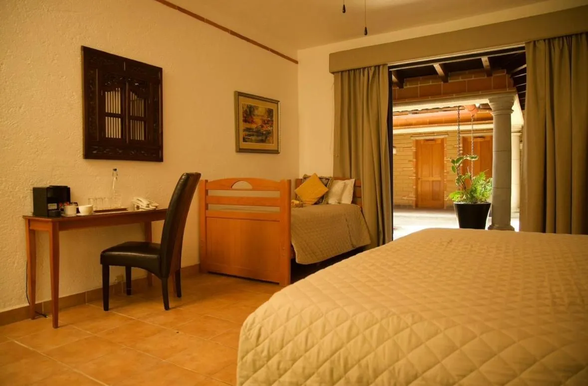 Bed in La Buena Vibra Wellness Resort & Spa