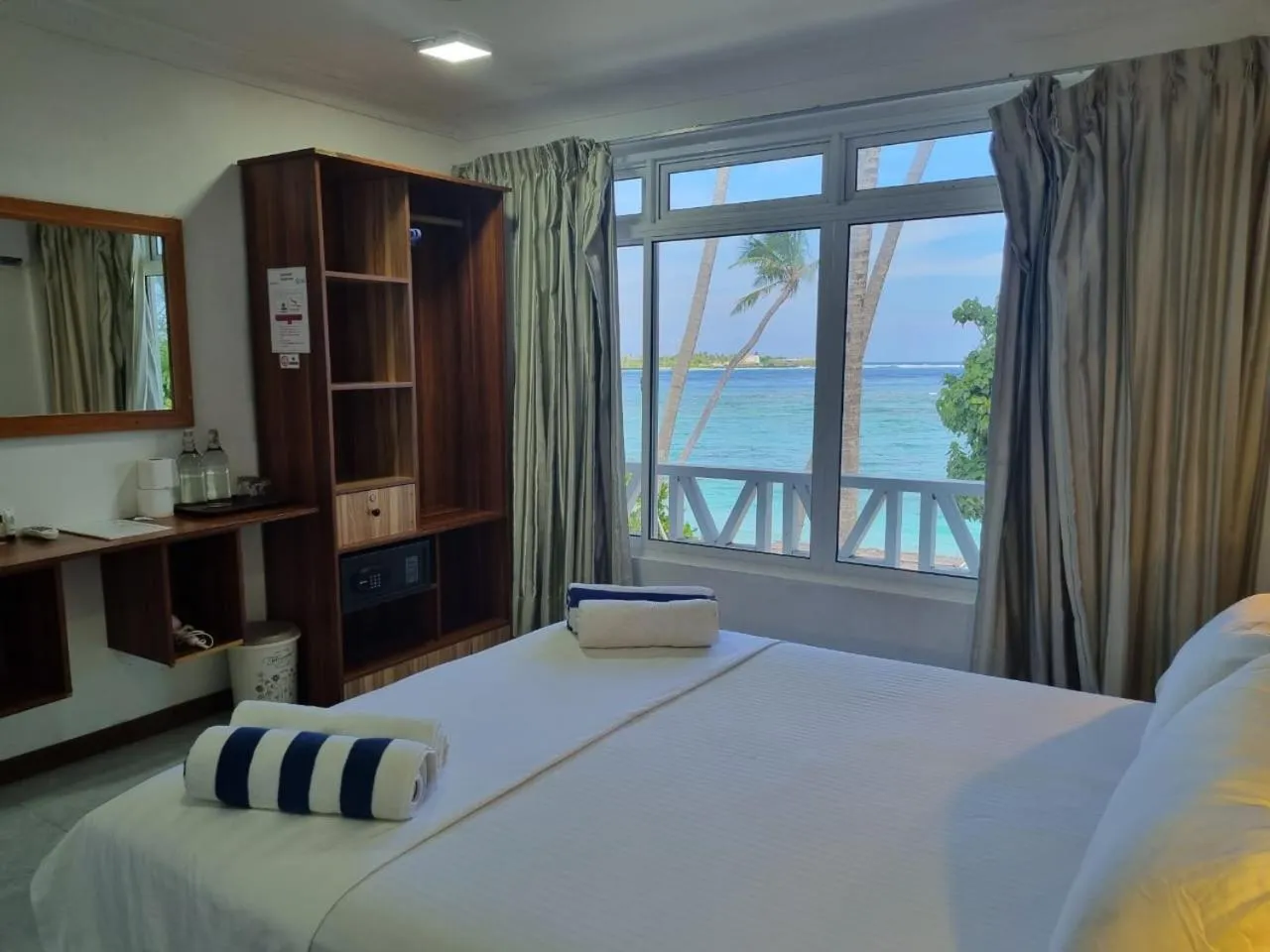 Property building, Bed in Batuta Maldives Surf View