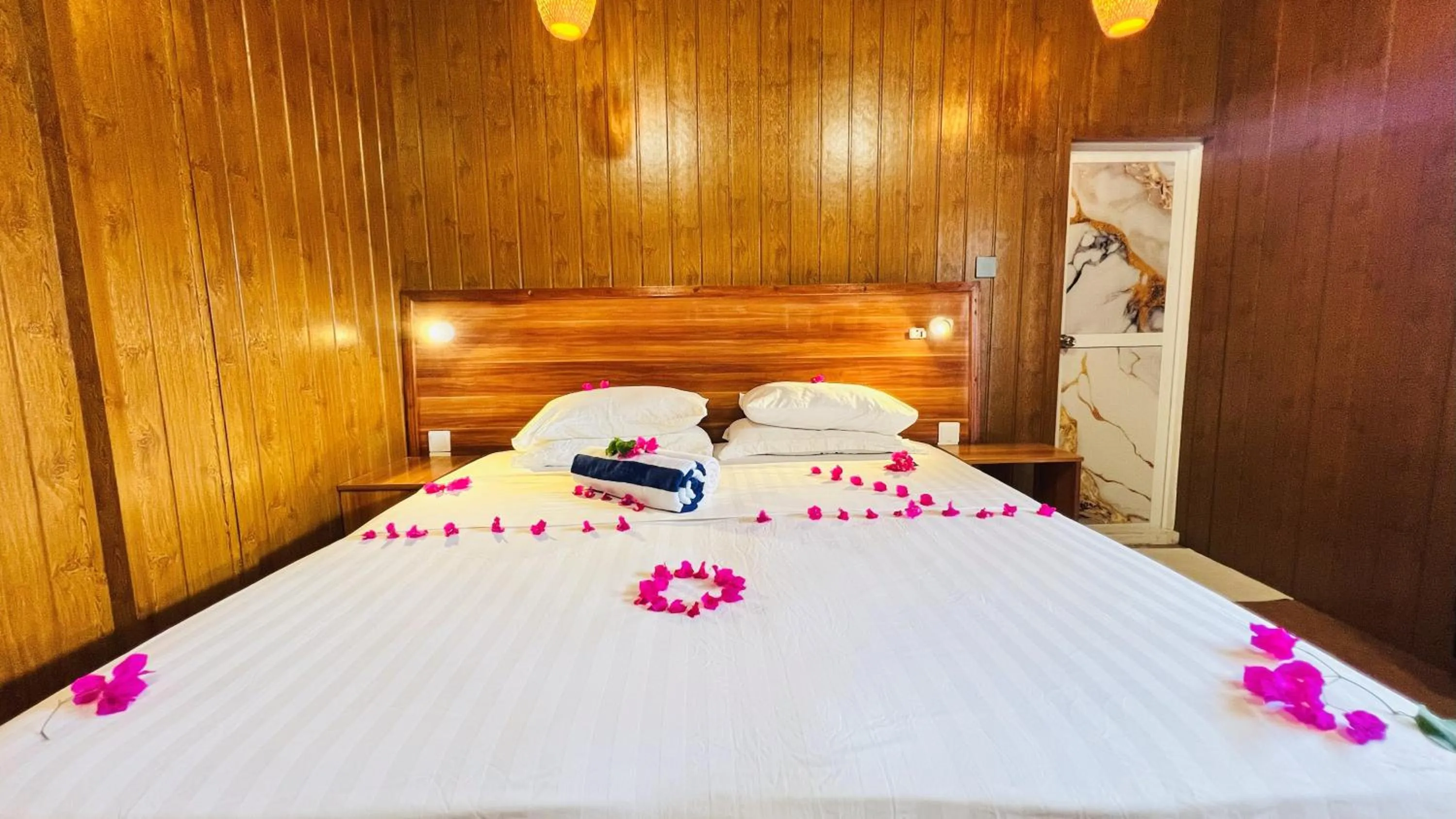 Bed in Batuta Maldives Surf View