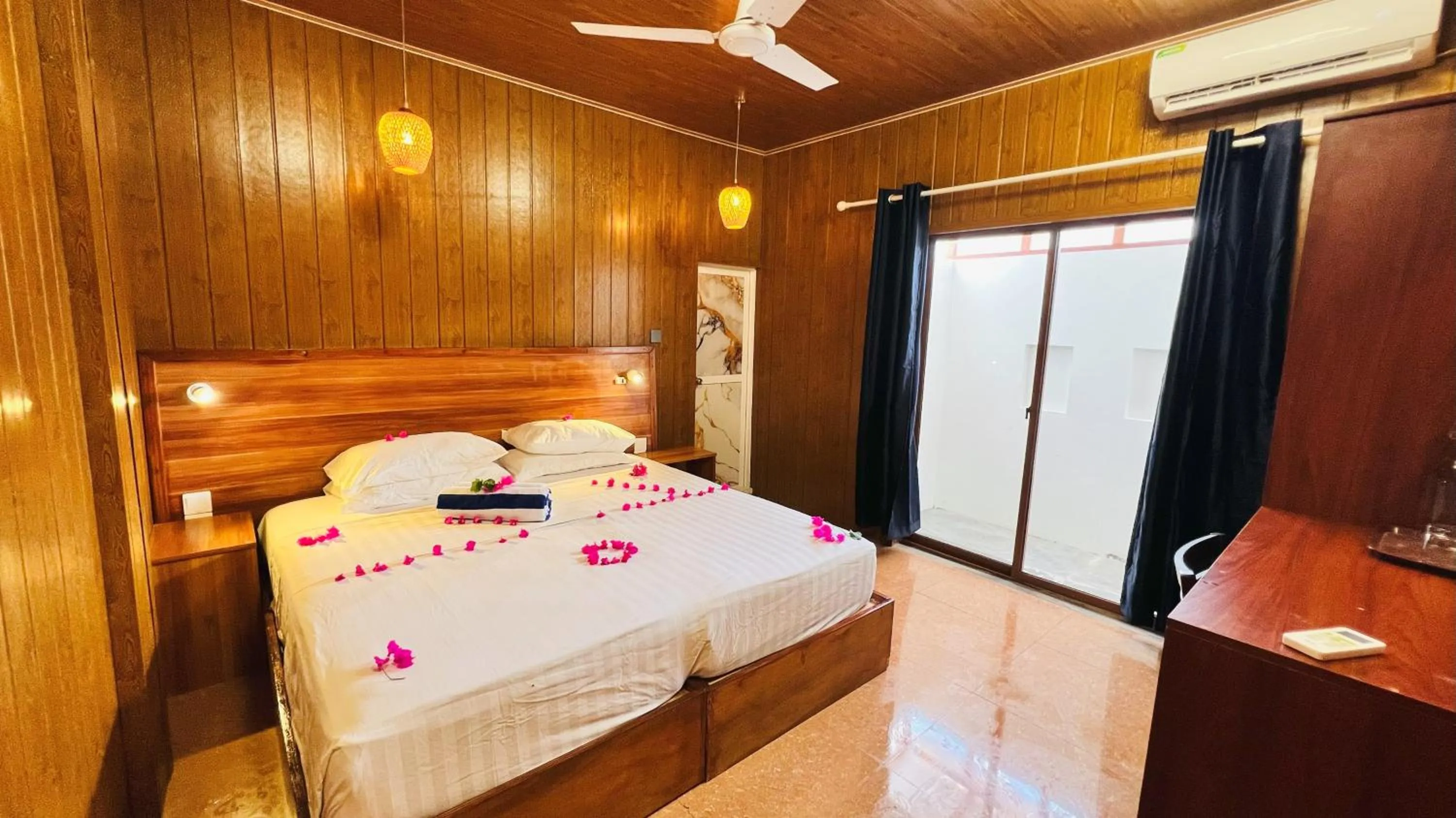Bed in Batuta Maldives Surf View