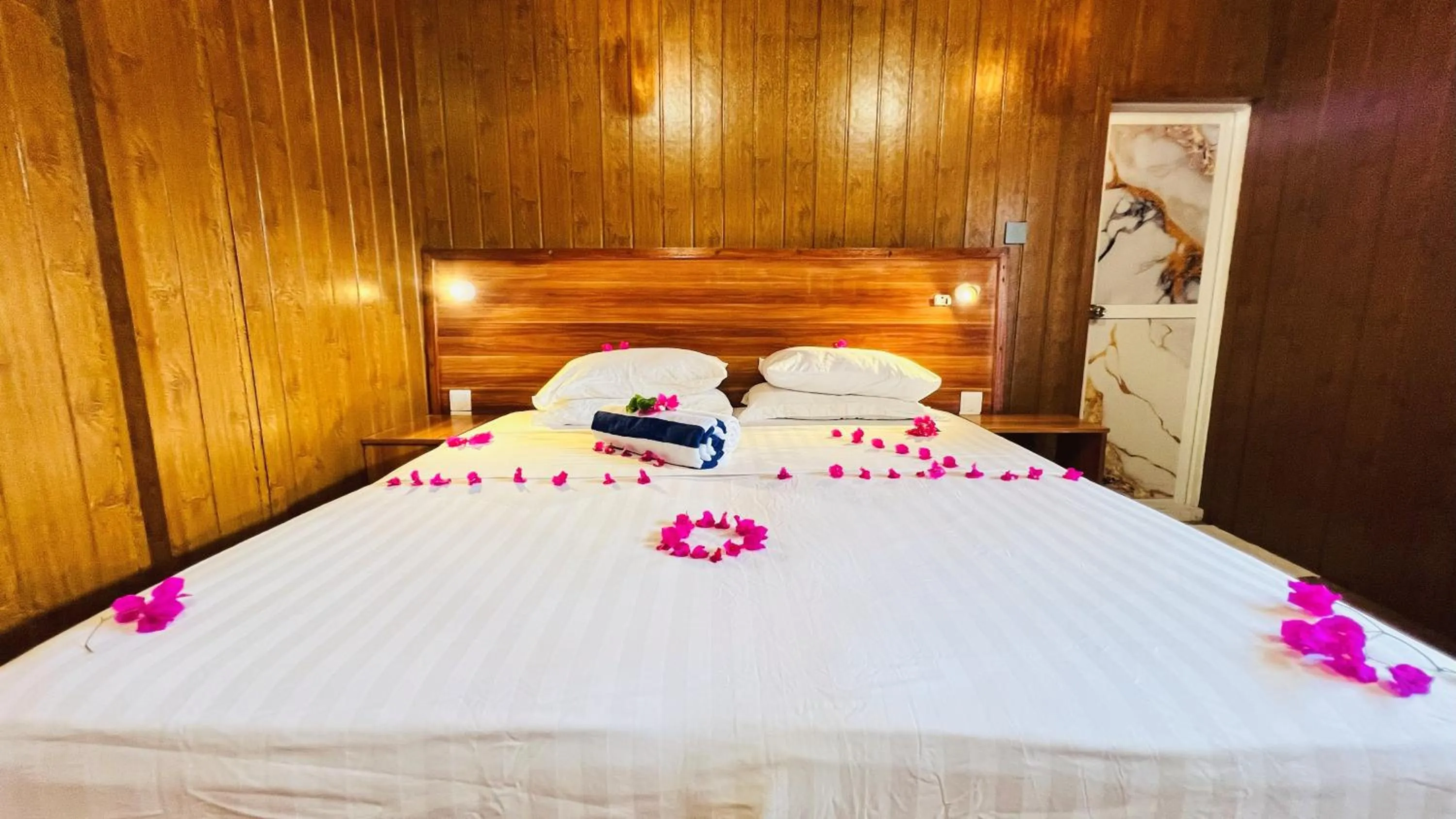 Bed in Batuta Maldives Surf View