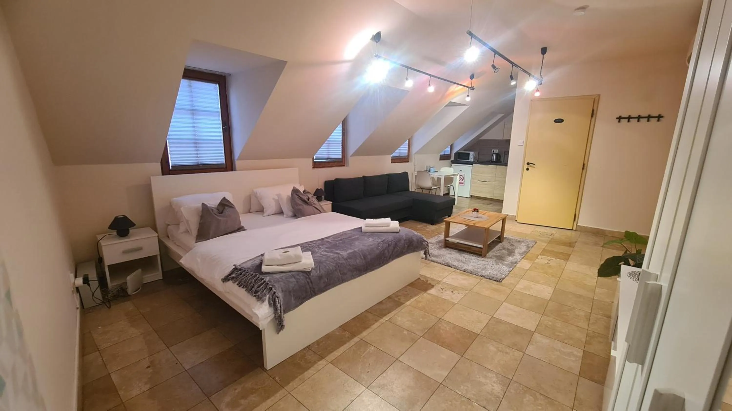 Bed in Downtown Apartments DeLuxe