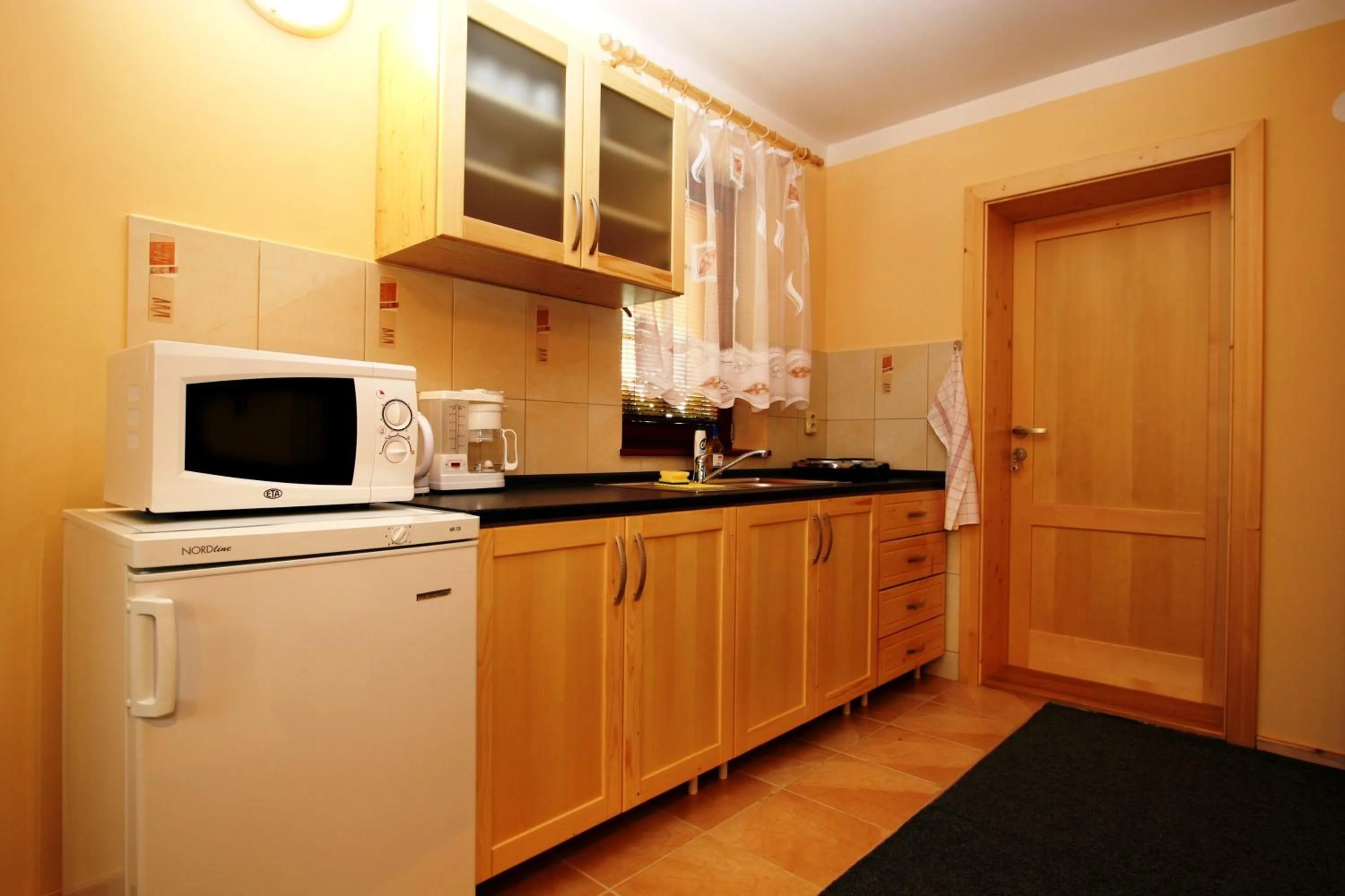 Kitchen or kitchenette in Ada Apartments