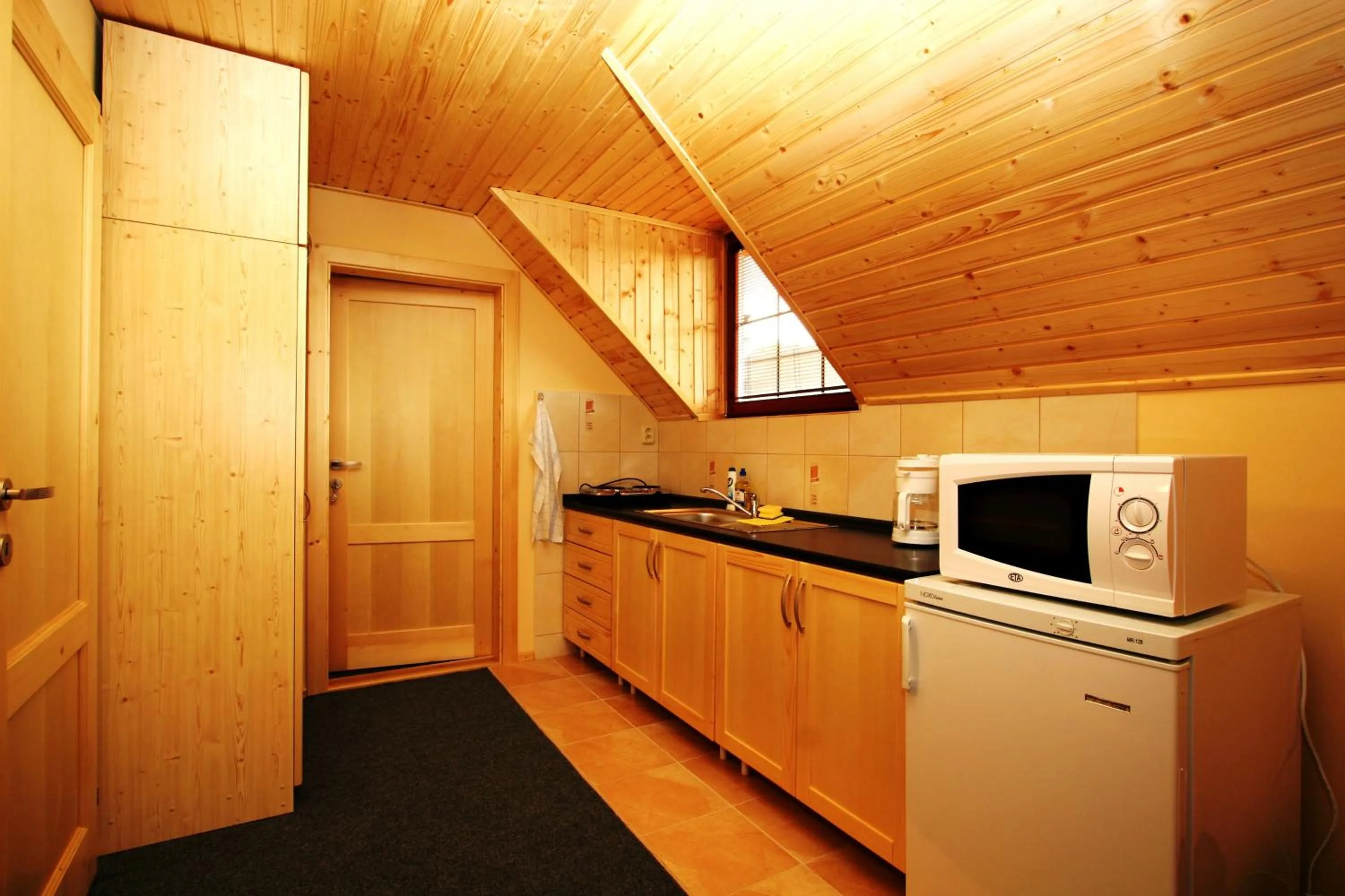 Kitchen or kitchenette in Ada Apartments