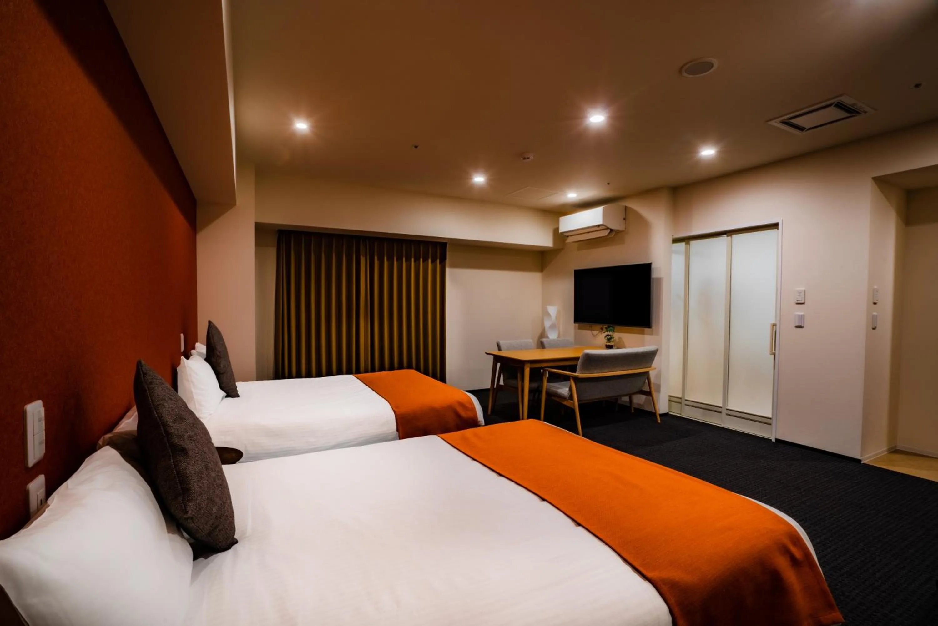 Photo of the whole room, Bed in Randor Hotel Sapporo Suites