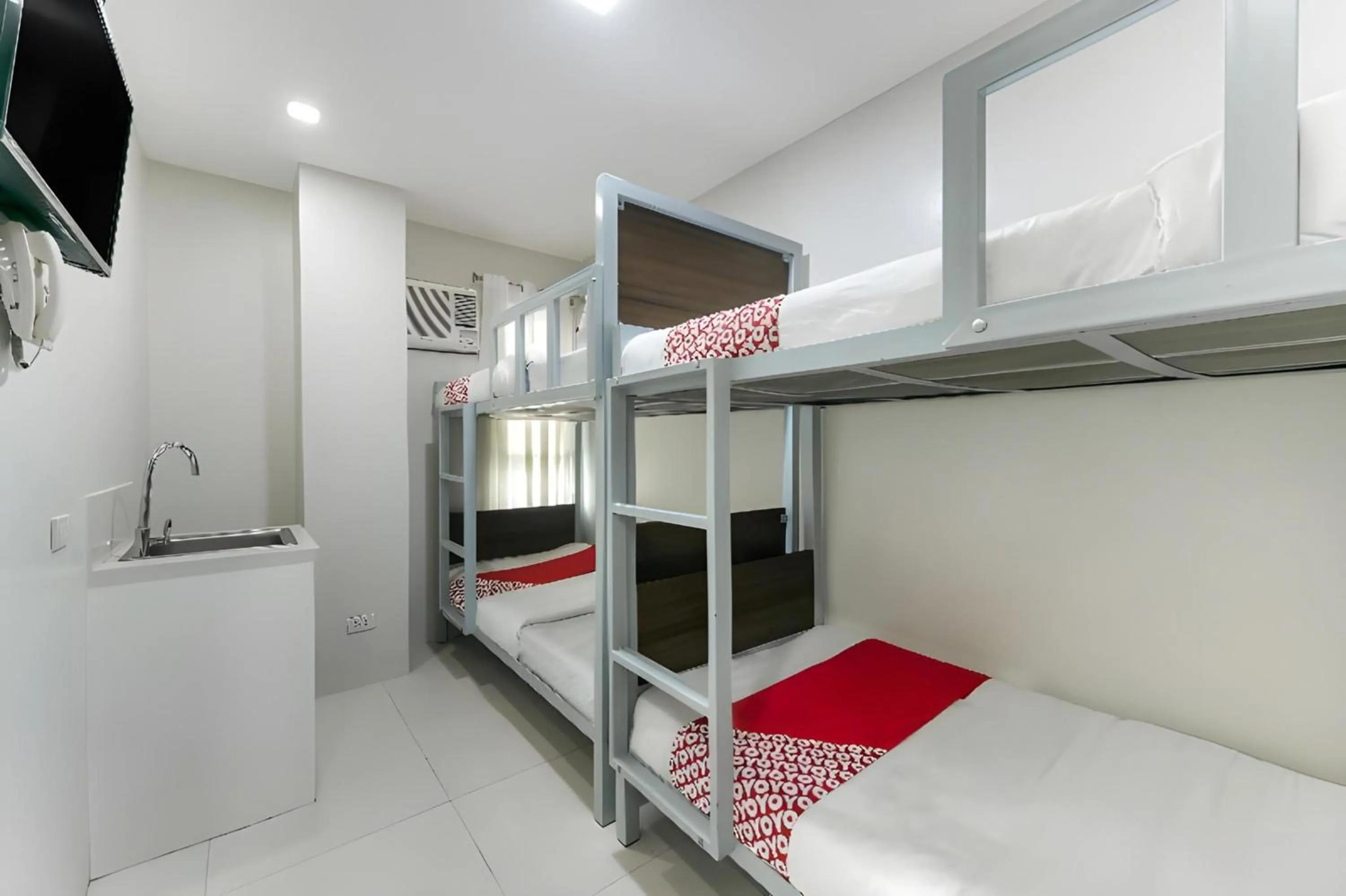 Bedroom, Bed in OYO 152 Sangco Condotel