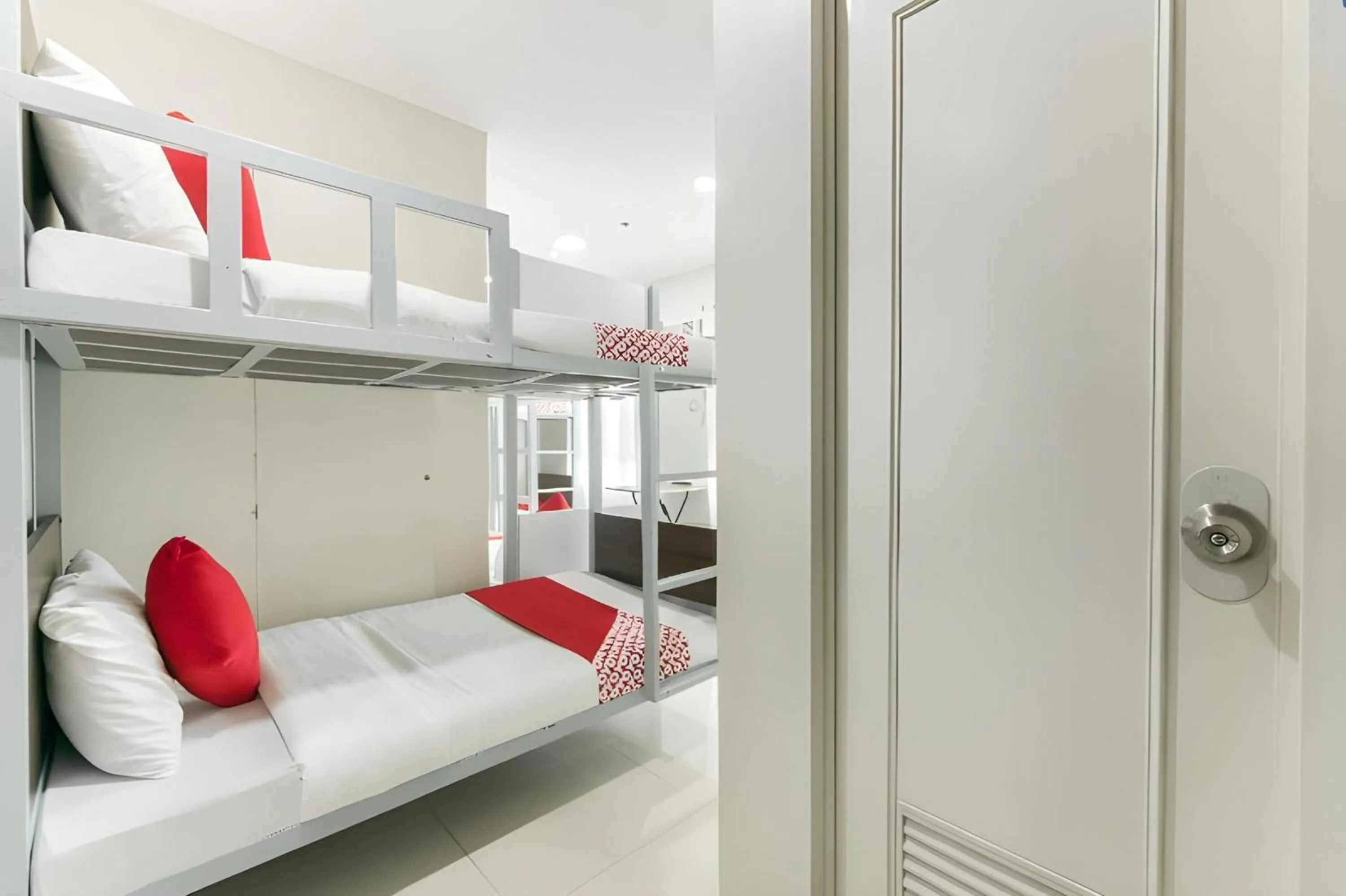 Bedroom, Bed in OYO 152 Sangco Condotel