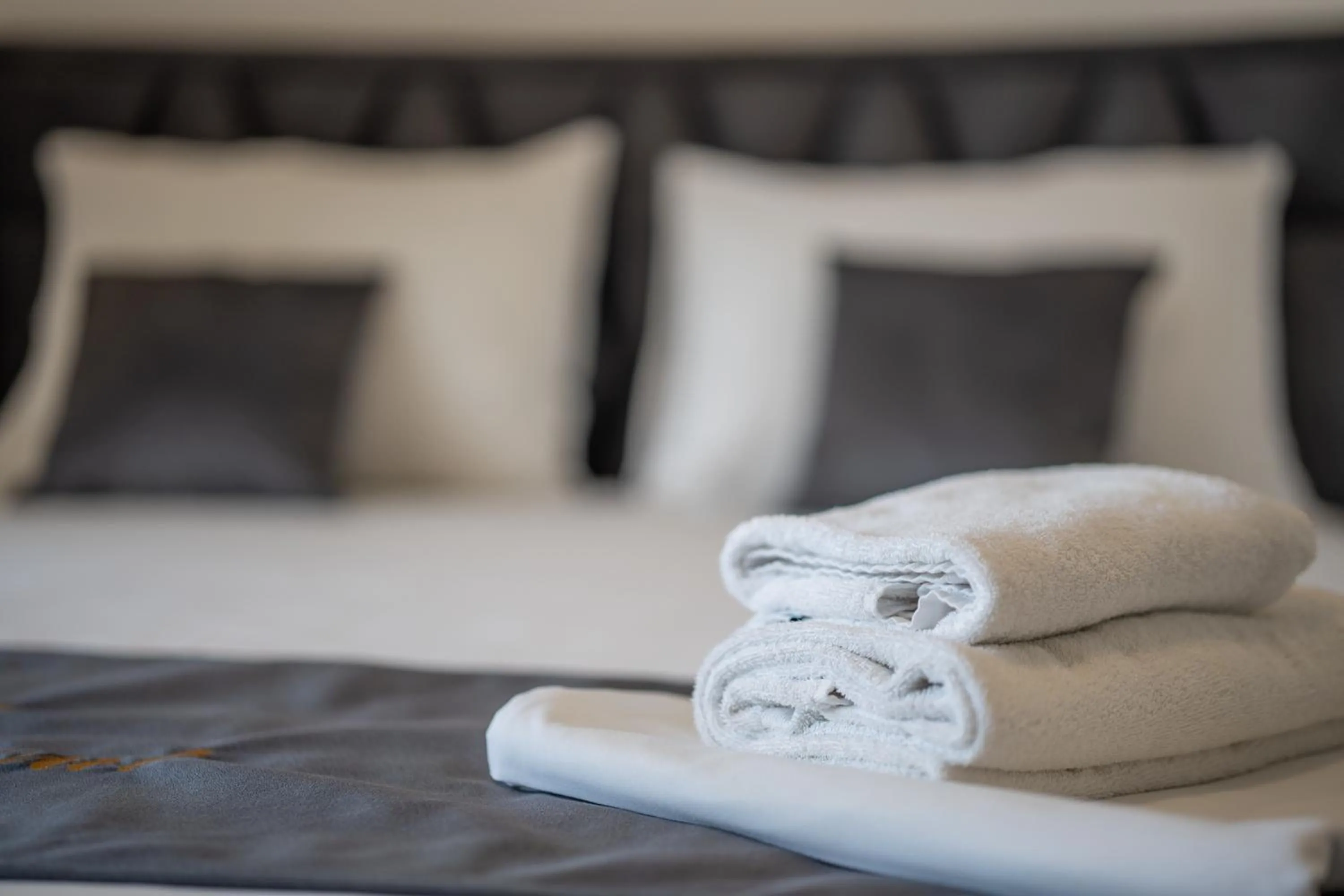 towels, Bed in Poolside Hideout Apartments