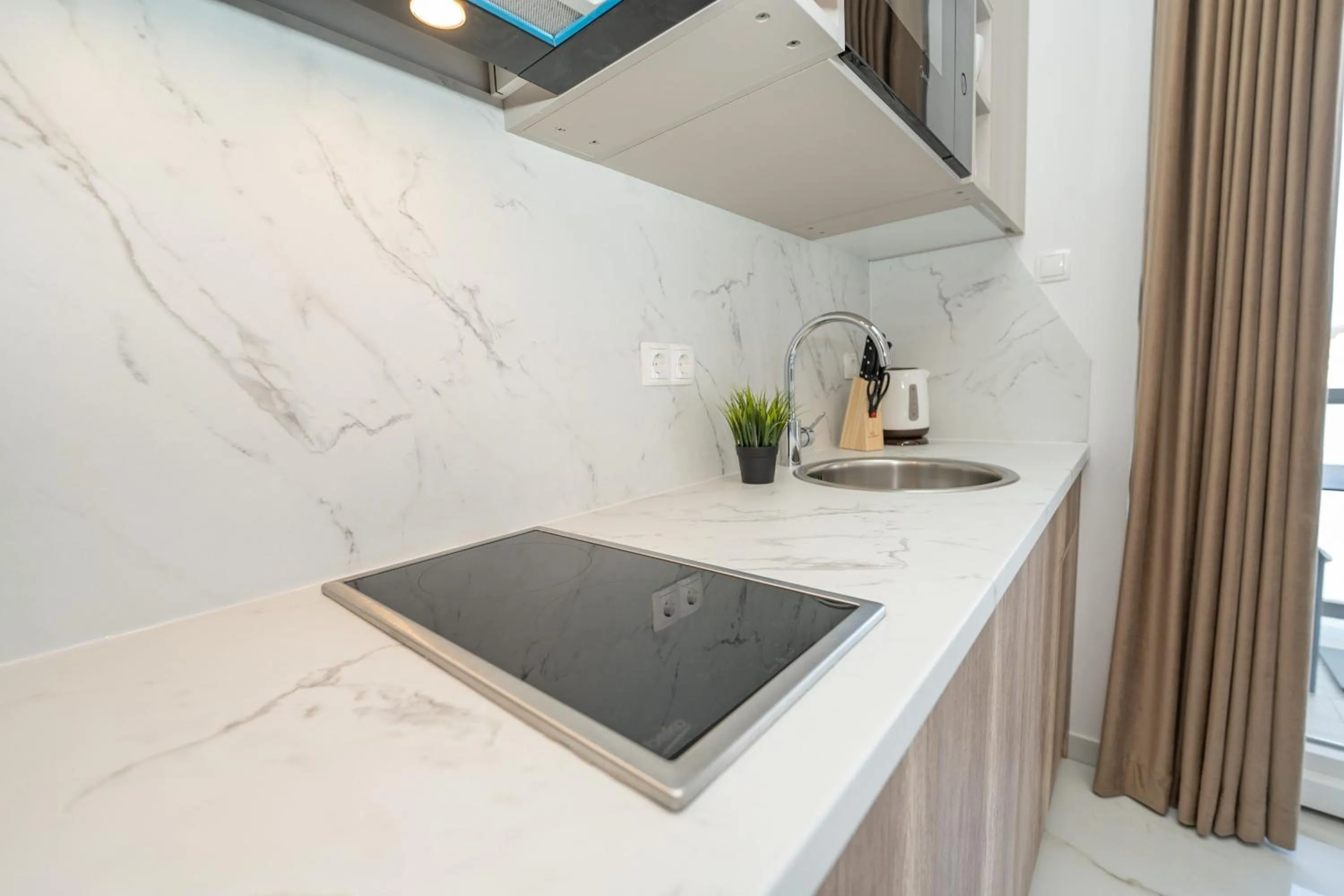 Kitchen or kitchenette in Poolside Hideout Apartments