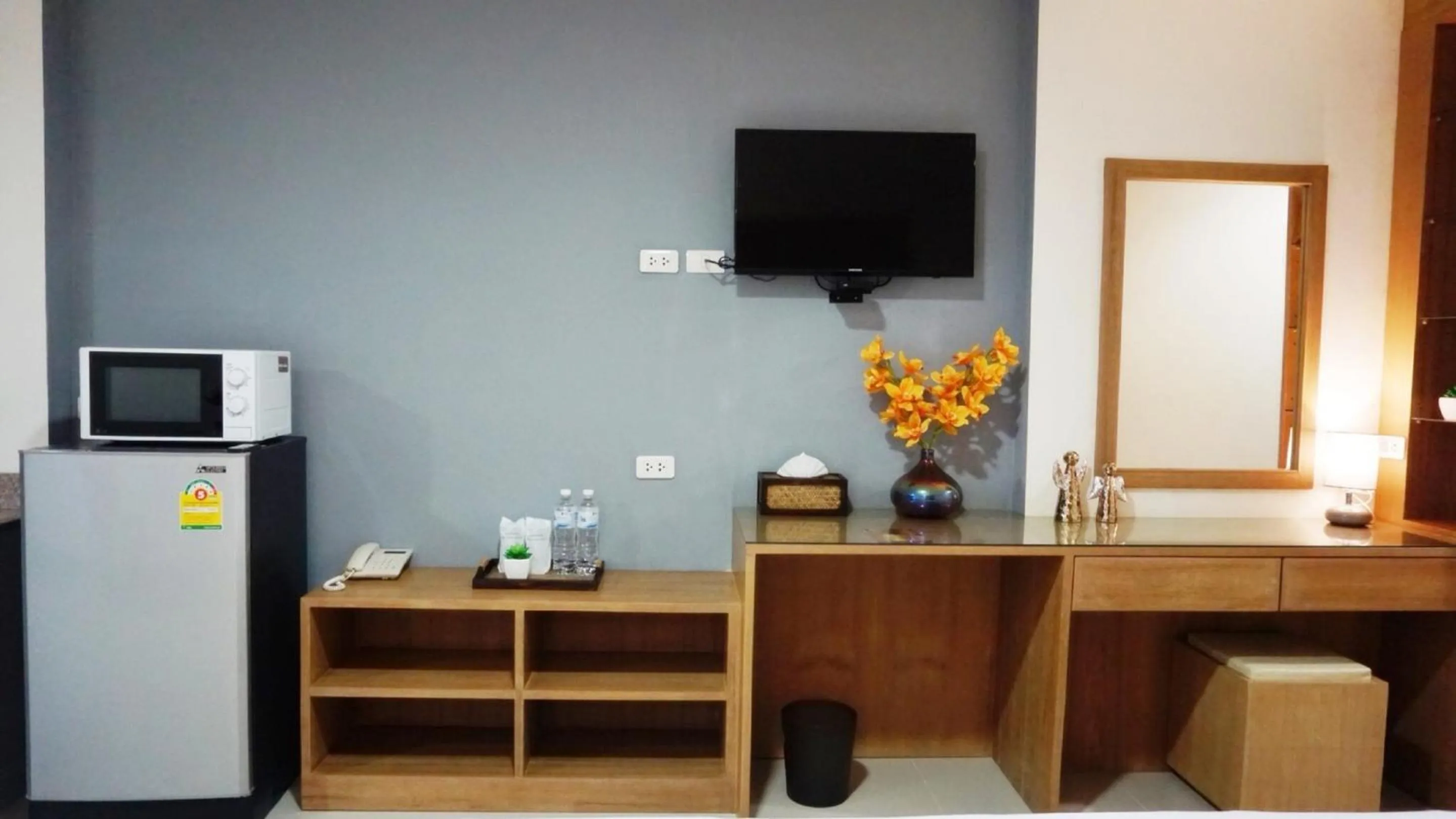 TV and multimedia in The Greenery central suite & hotel