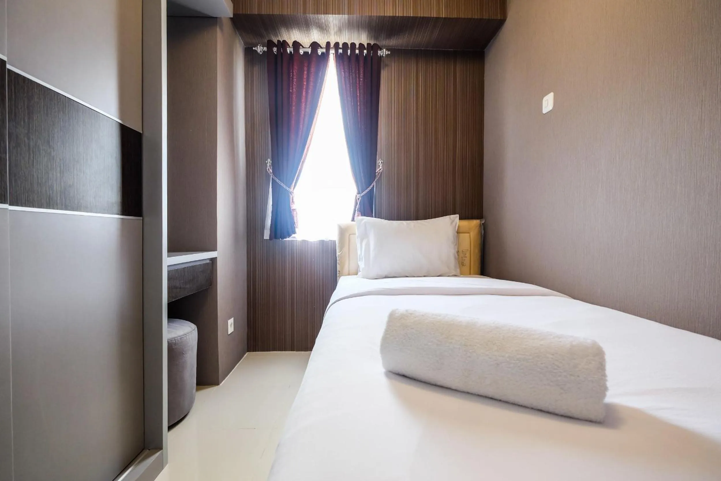 Bed in Modern and Comfort 2BR Bassura City Apartment By Travelio