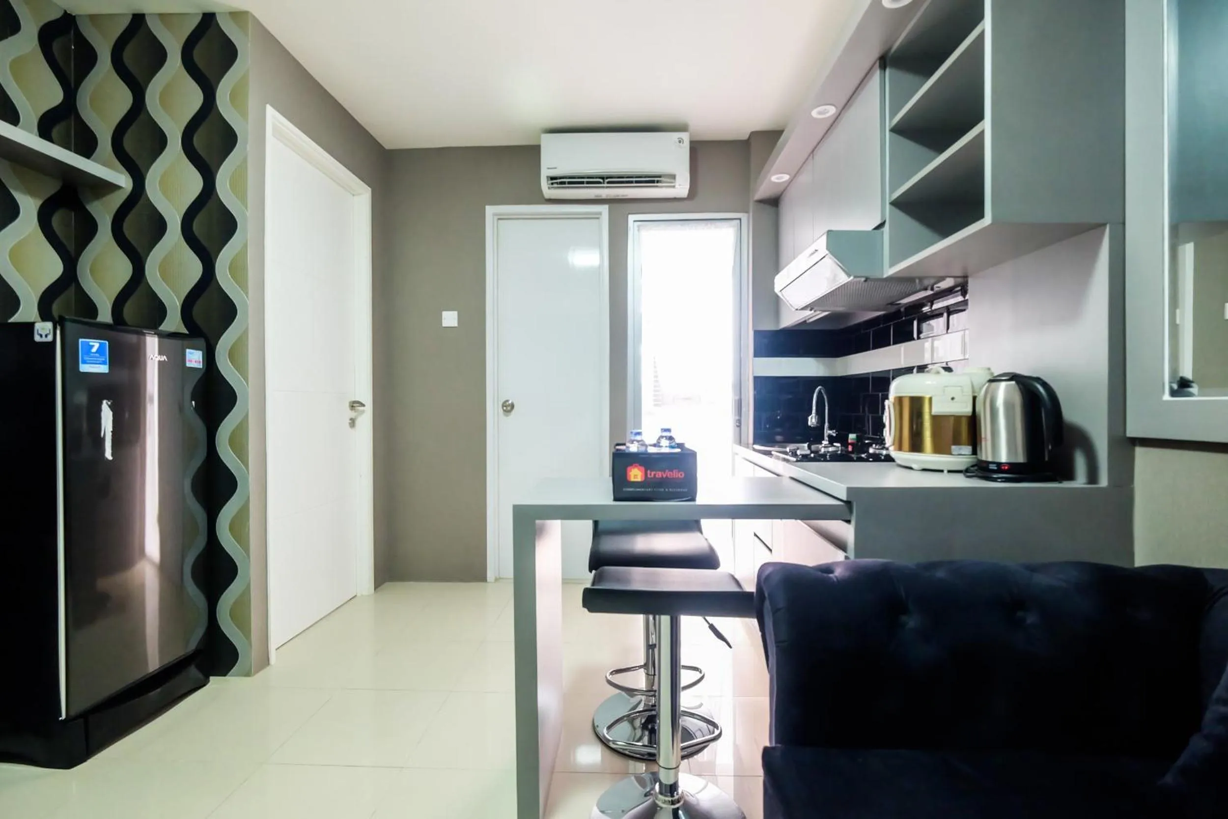 Dining area in Modern and Comfort 2BR Bassura City Apartment By Travelio