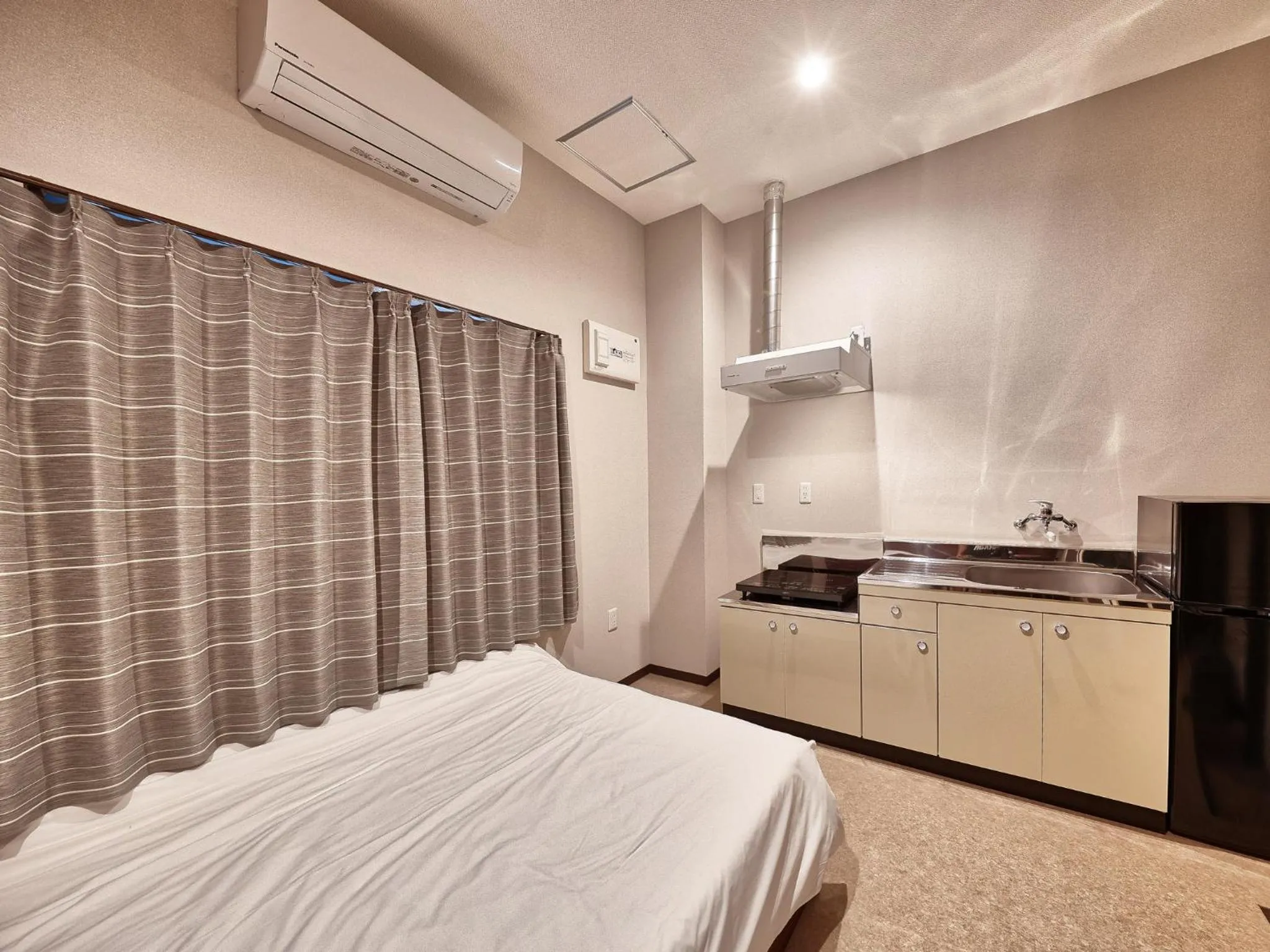 Kitchen or kitchenette, Bed in Okinawa City Hotel