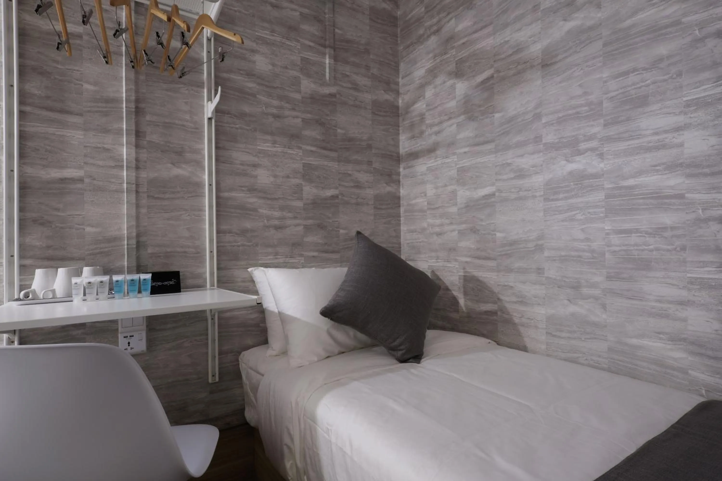 Bed in Q Loft Hotels at Bedok