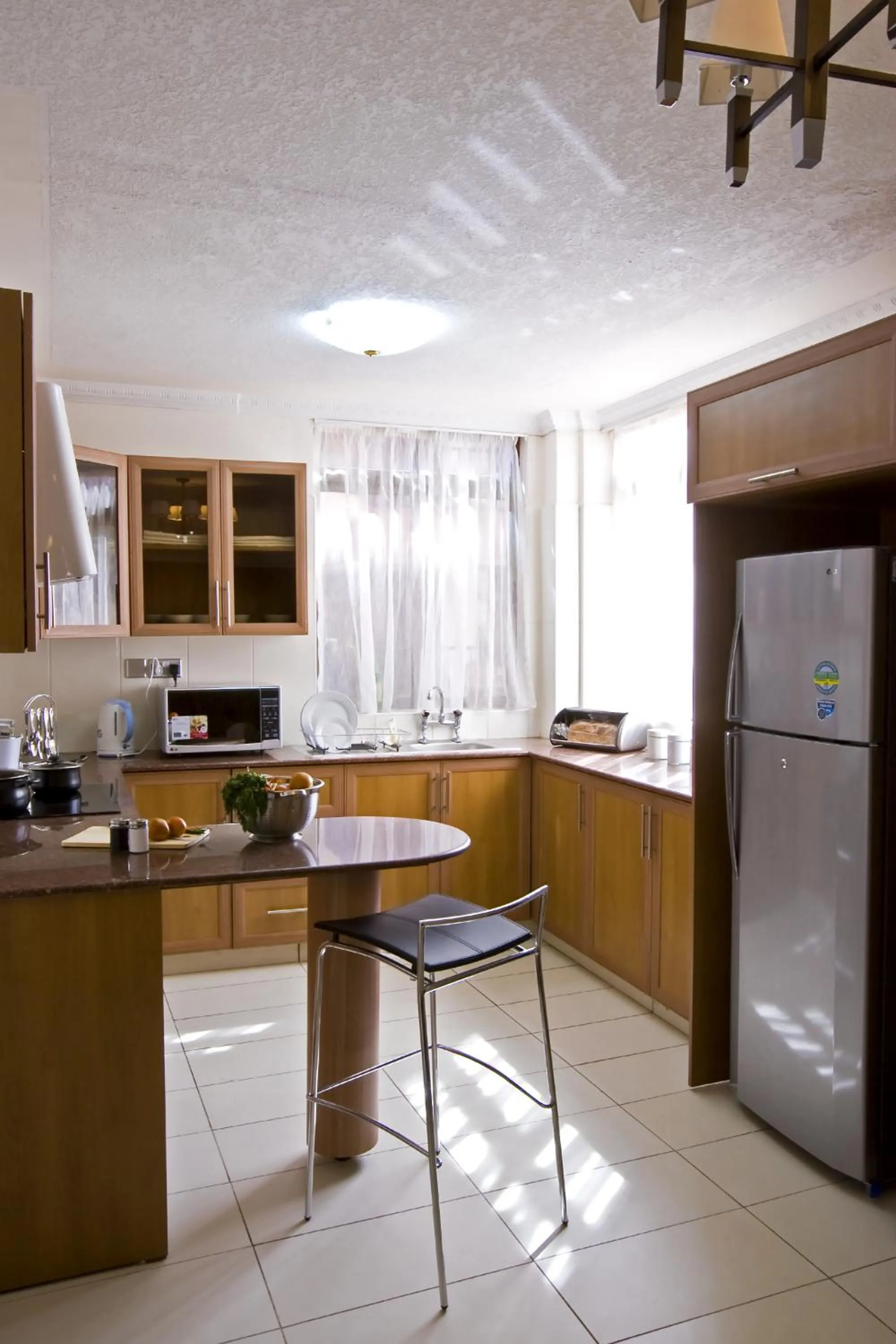 Kitchen or kitchenette in GemSuites Serviced Apartments State House