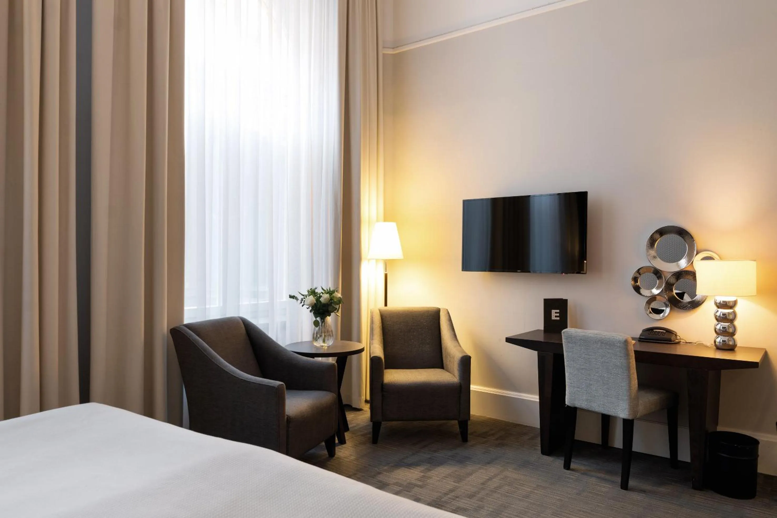 Seating area, Bed in Elite Grand Hotel Gävle