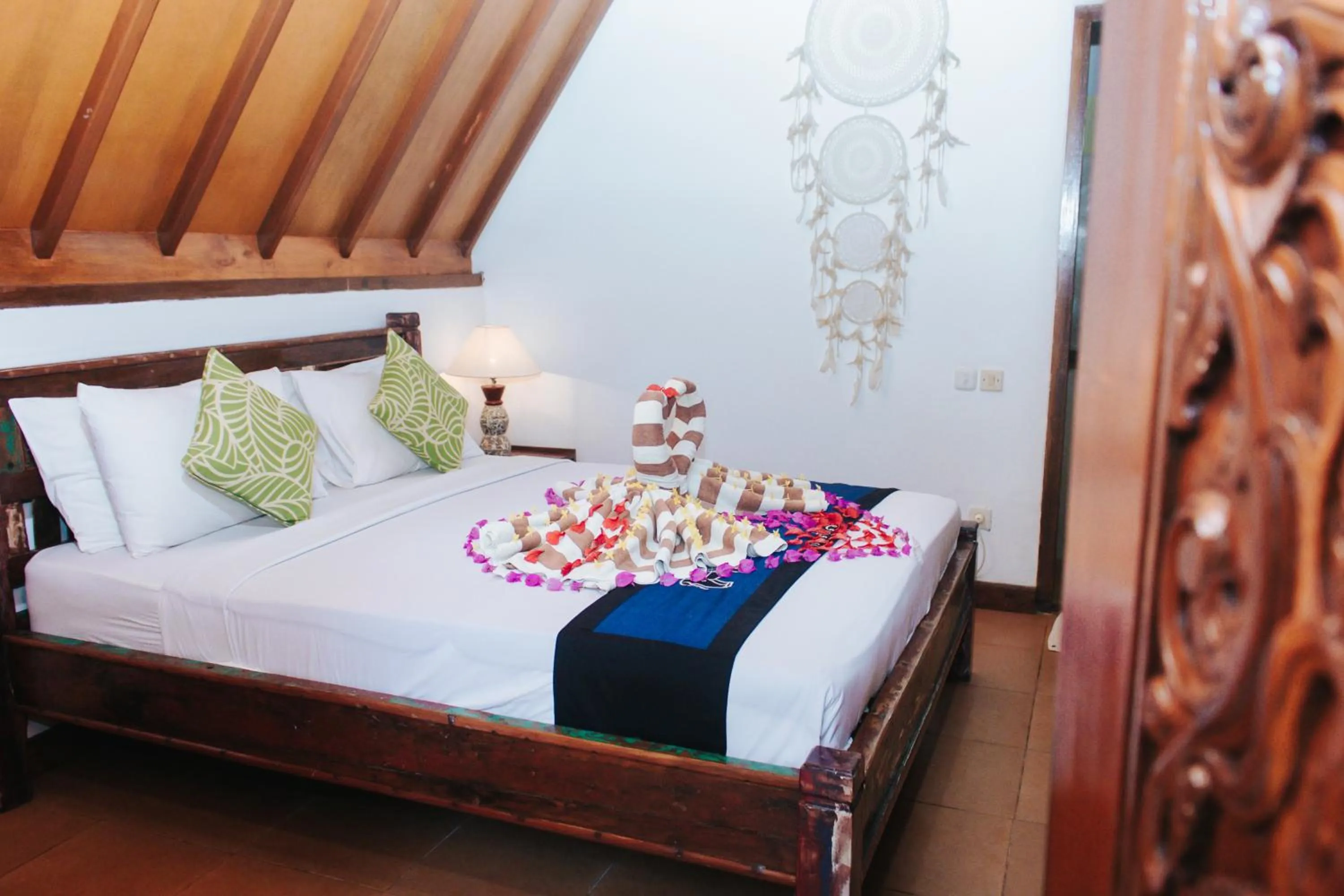 Bed in Lucy's Garden Hotel